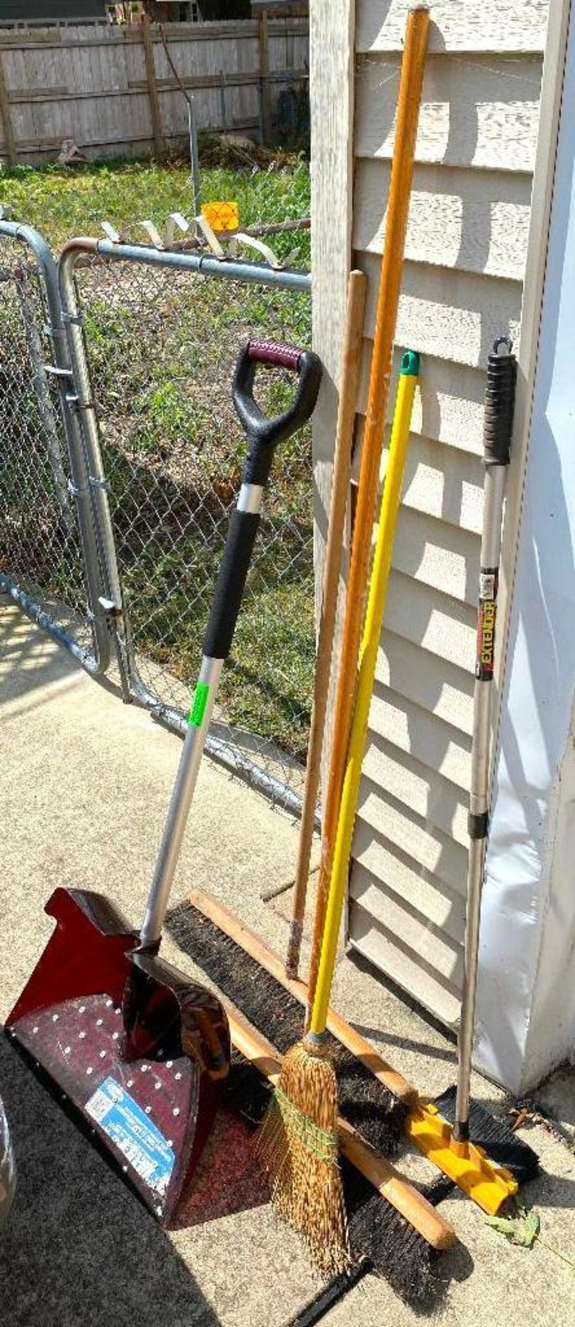 DESCRIPTION ASSORTED BROOMS AND SHOVEL AS SHOWN LOCATION GARAGE #1 THIS LOT IS ONE MONEY QUANTITY 1