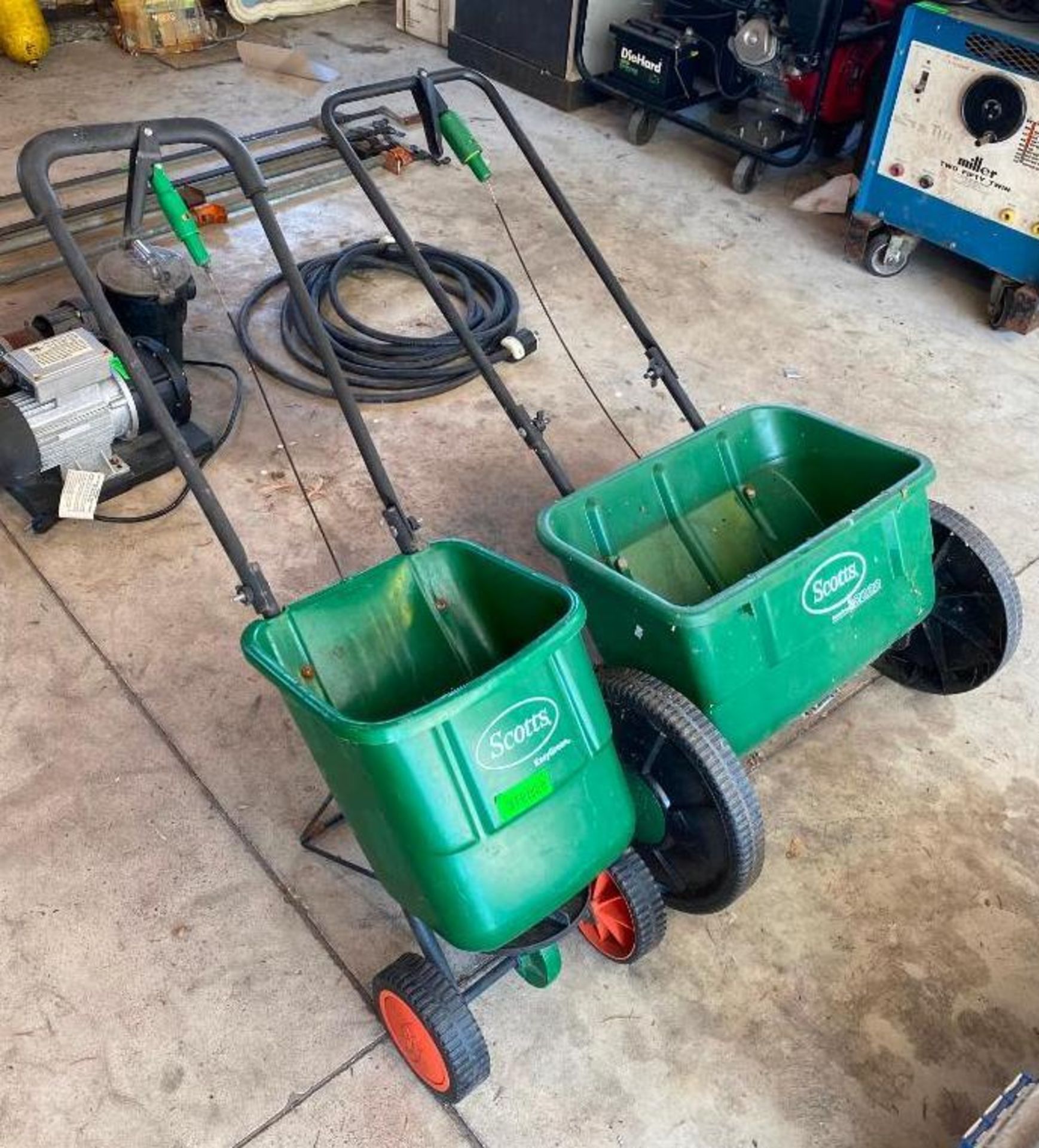 DESCRIPTION (2) LAWN SPREADERS BRAND/MODEL SCOTTS LOCATION GARAGE THIS LOT IS ONE MONEY QUANTITY: X