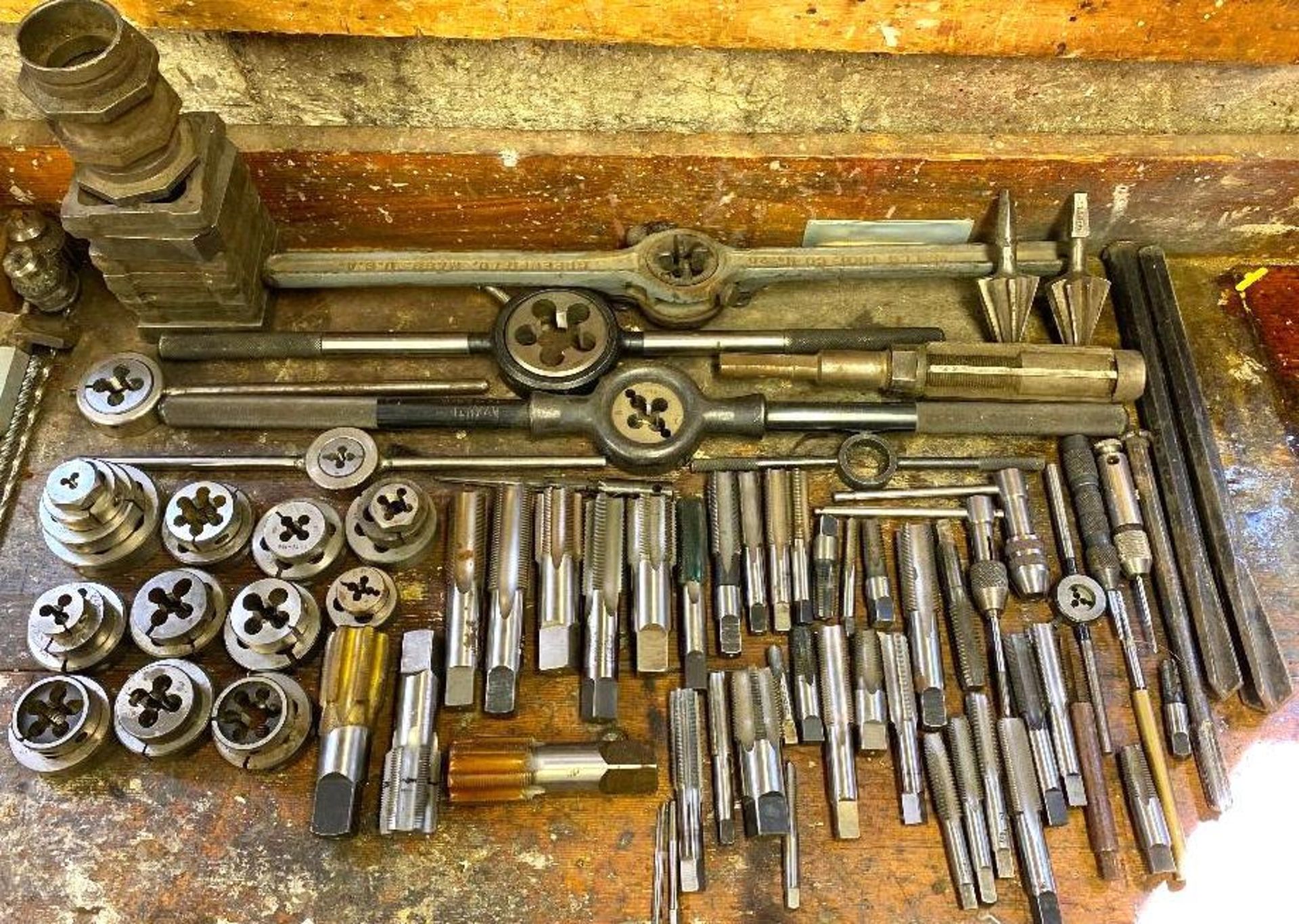 DESCRIPTION LARGE ASSORTMENT OF TAP & DIE SETS AS SHOWN LOCATION BASEMENT THIS LOT IS ONE MONEY QUAN