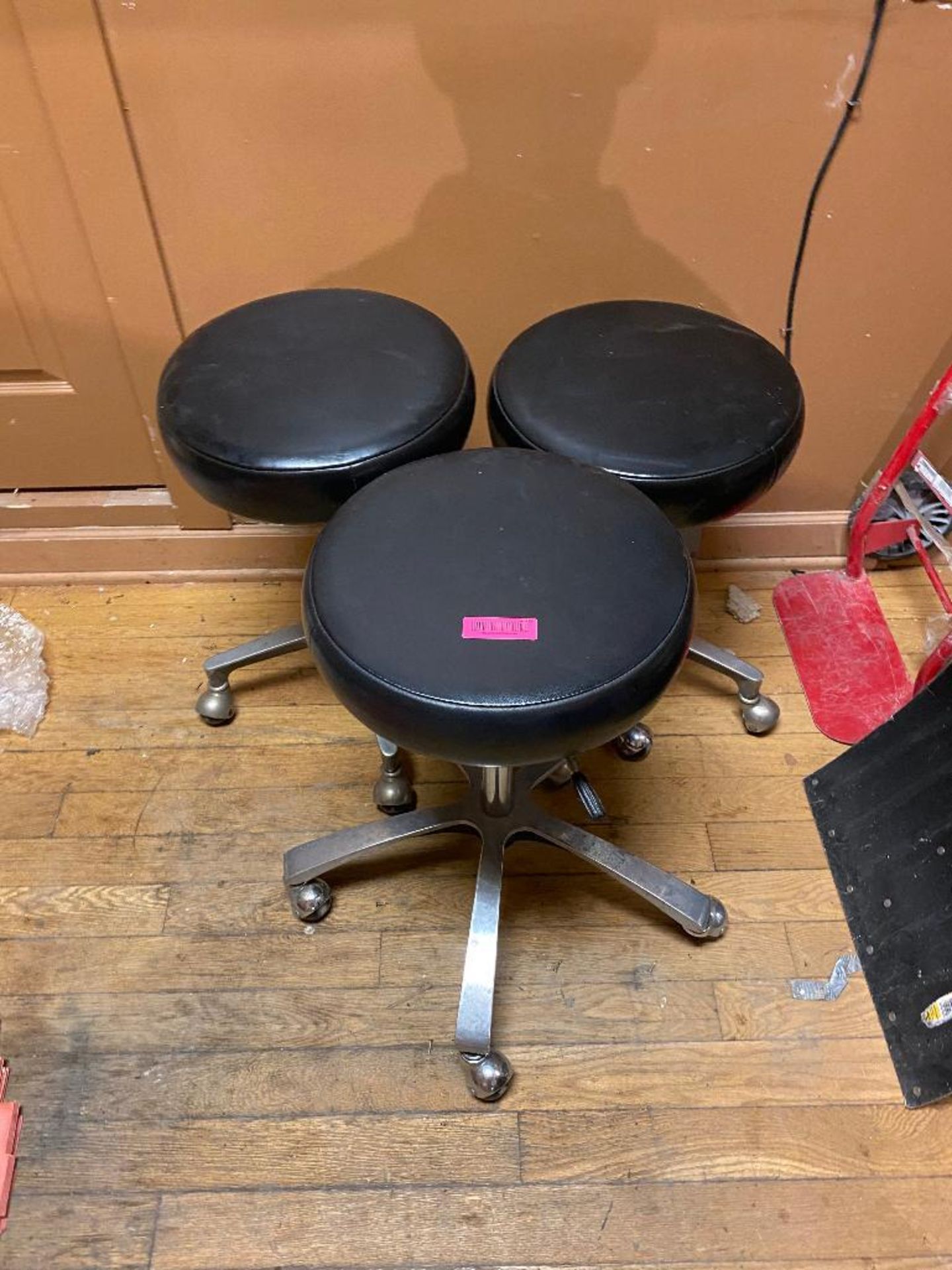 DESCRIPTION (3) LEATHER TOPPED WORK STOOLS ON CASTERS LOCATION UPSTAIRS: STORAGE CLOSET THIS LOT IS - Image 2 of 3