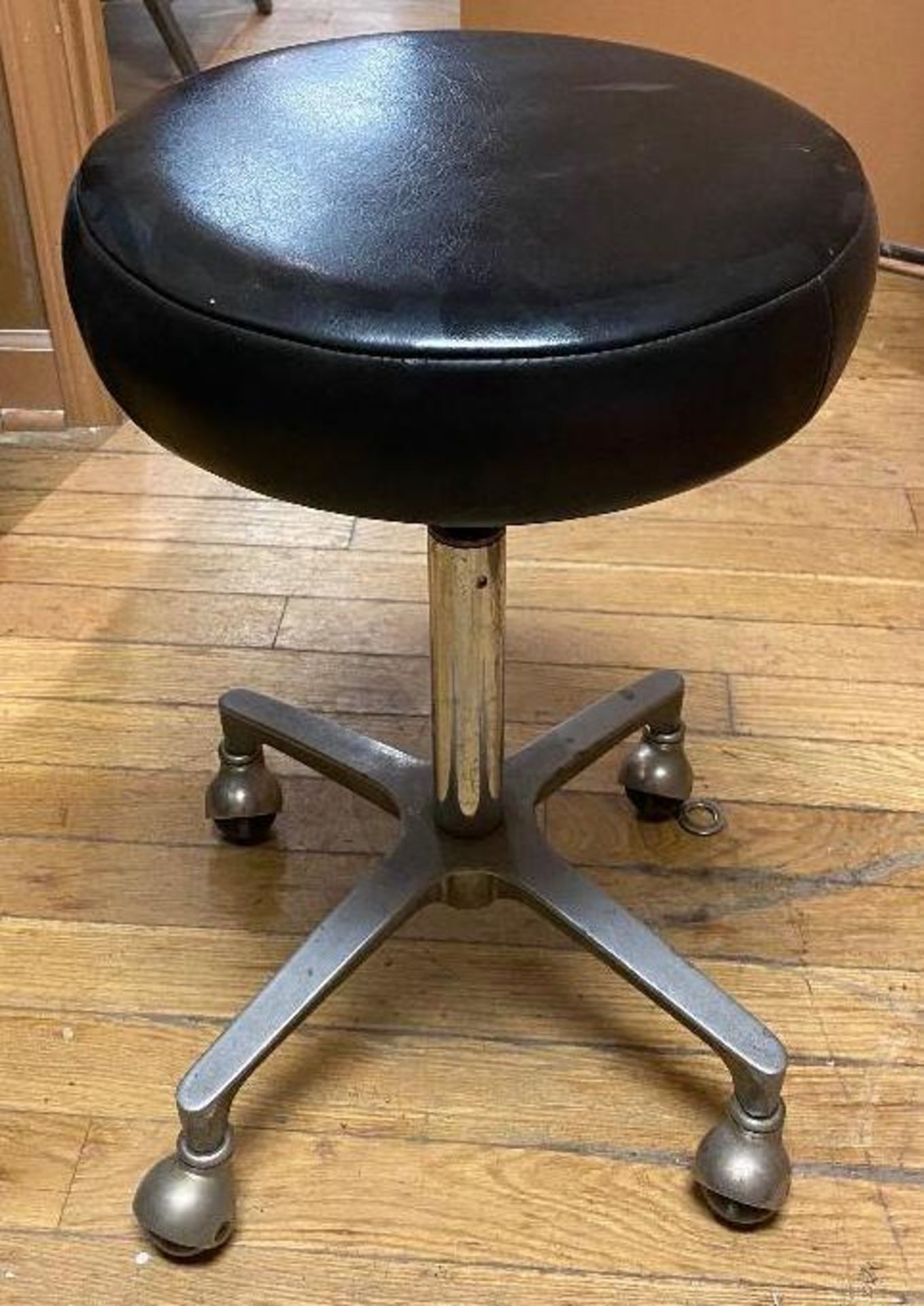 DESCRIPTION (3) LEATHER TOPPED WORK STOOLS ON CASTERS LOCATION UPSTAIRS: STORAGE CLOSET THIS LOT IS