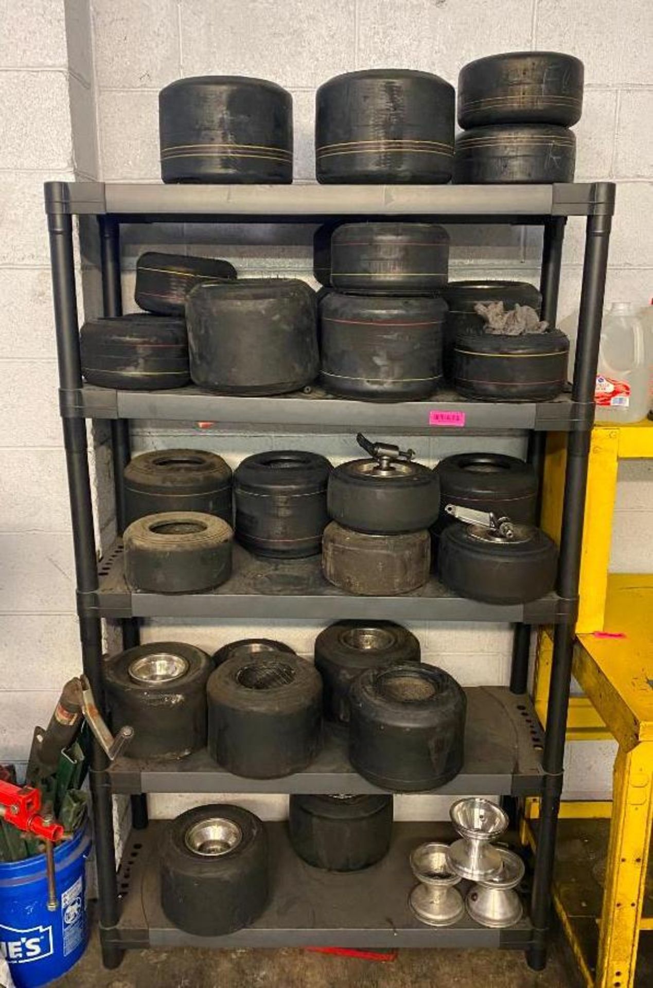 DESCRIPTION: SHELVING UNIT WITH ASSORTED GO KART TIRES THIS LOT IS: ONE MONEY QTY: 1