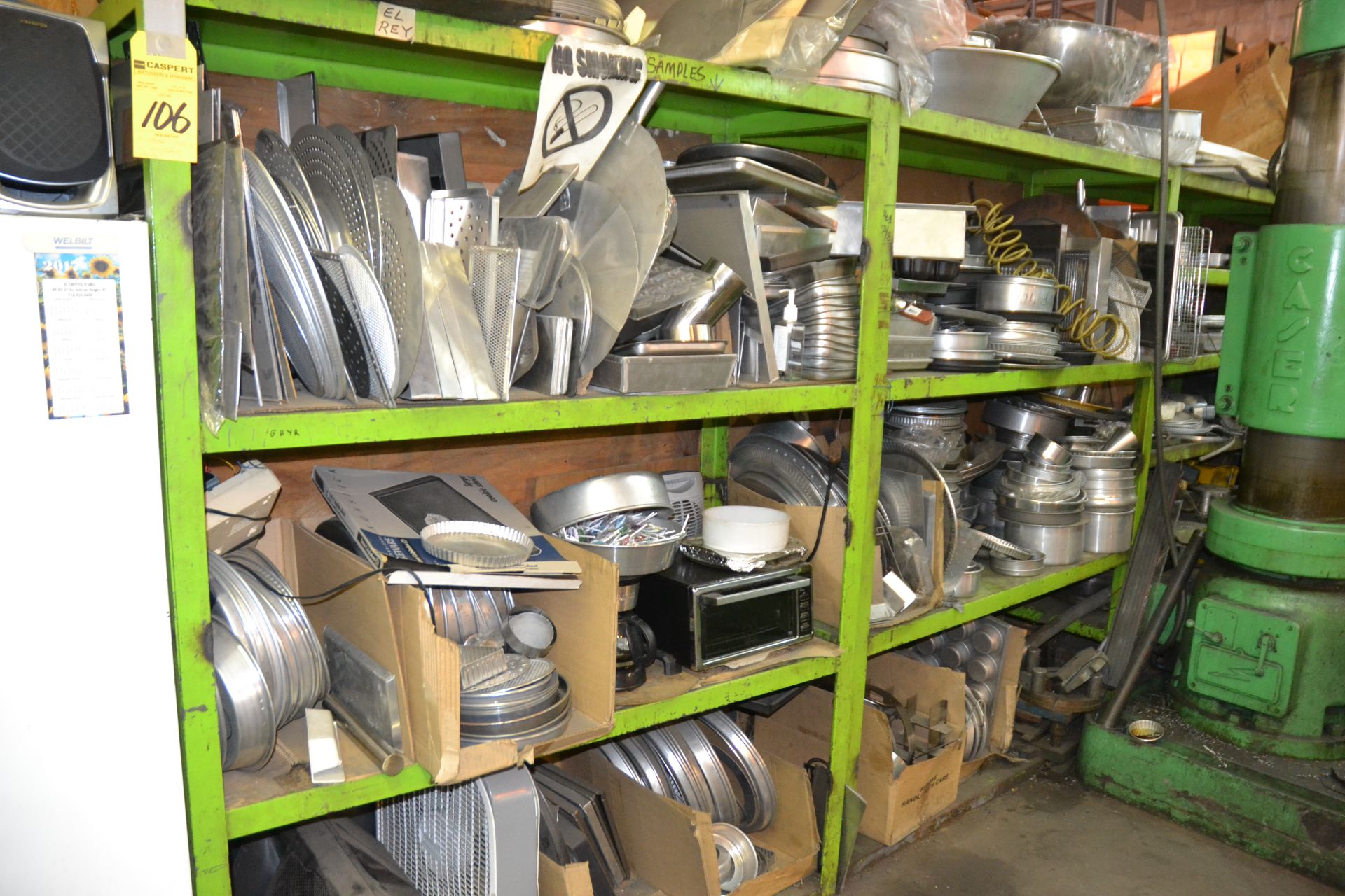 Sections of Green Steel Shelving with Contents