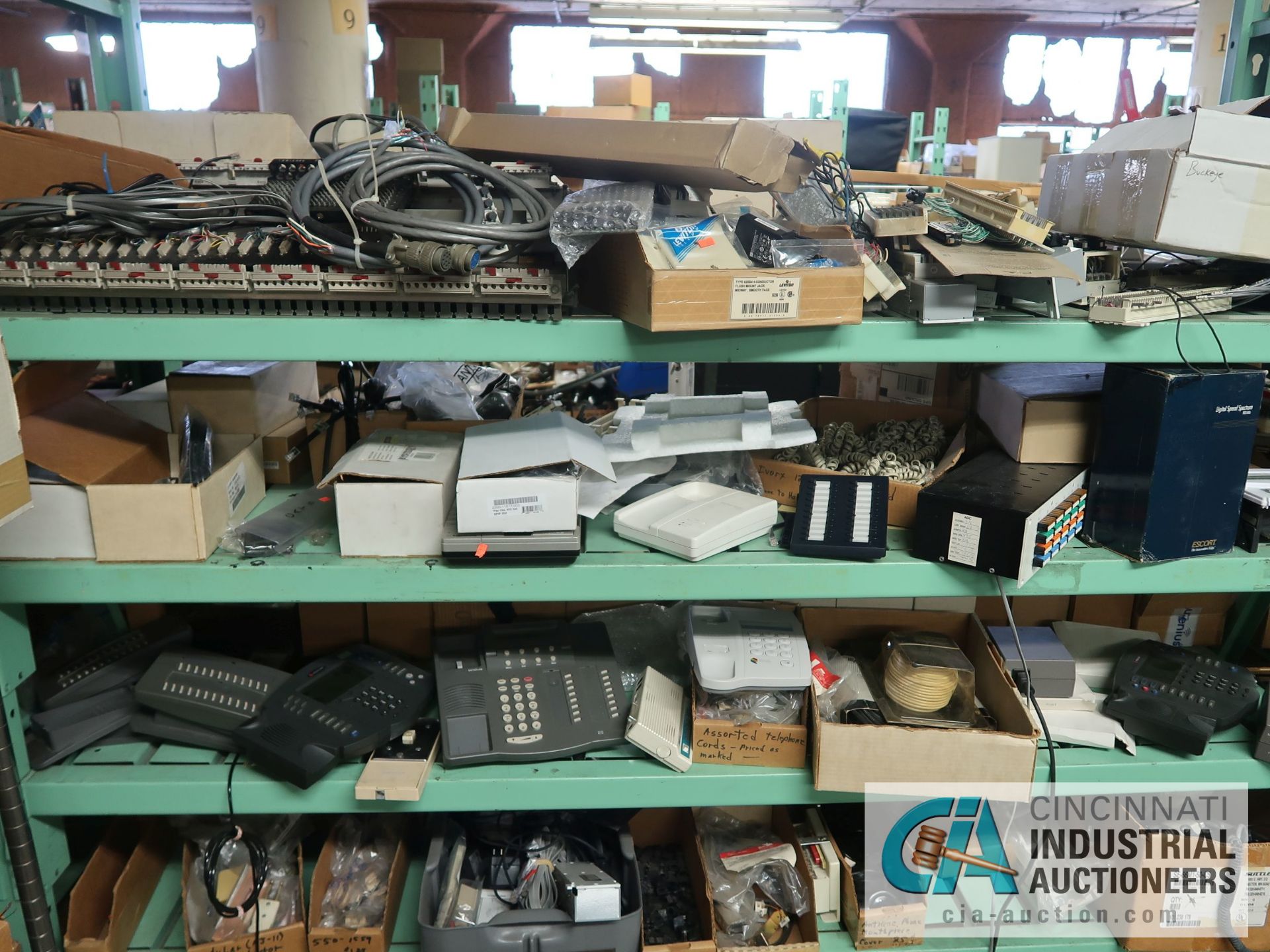 CONTENTS OF (5) RACKS INCLUDING MISCELLANEOUS PHONE PARTS, CHARGERS, FACE PLATES, CORDS, AMPLIFIERS, - Image 15 of 21