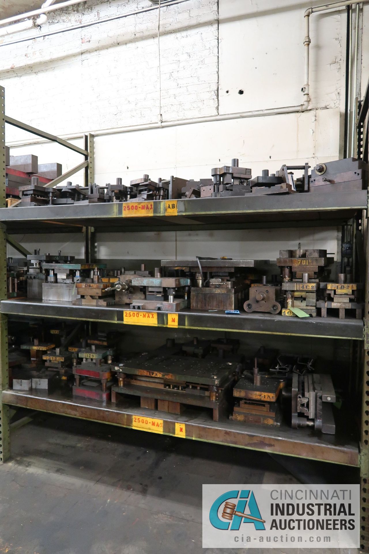 (LOT) CONTENTS OF (1) SECTION RACK CONSISTING OF PRESS DIES (APPROX. 60)