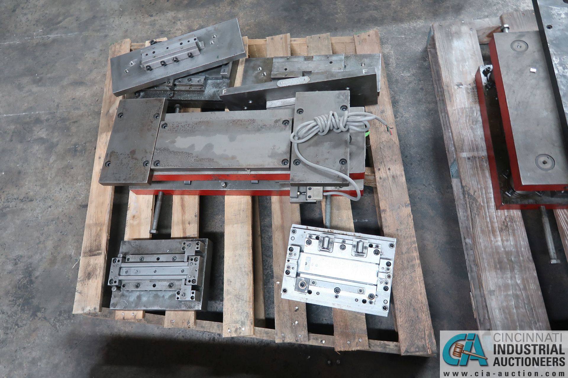 (LOT) LARGE QTY. PUNCH PRESS DIES IN (4) ROWS ON FLOOR - Image 11 of 34