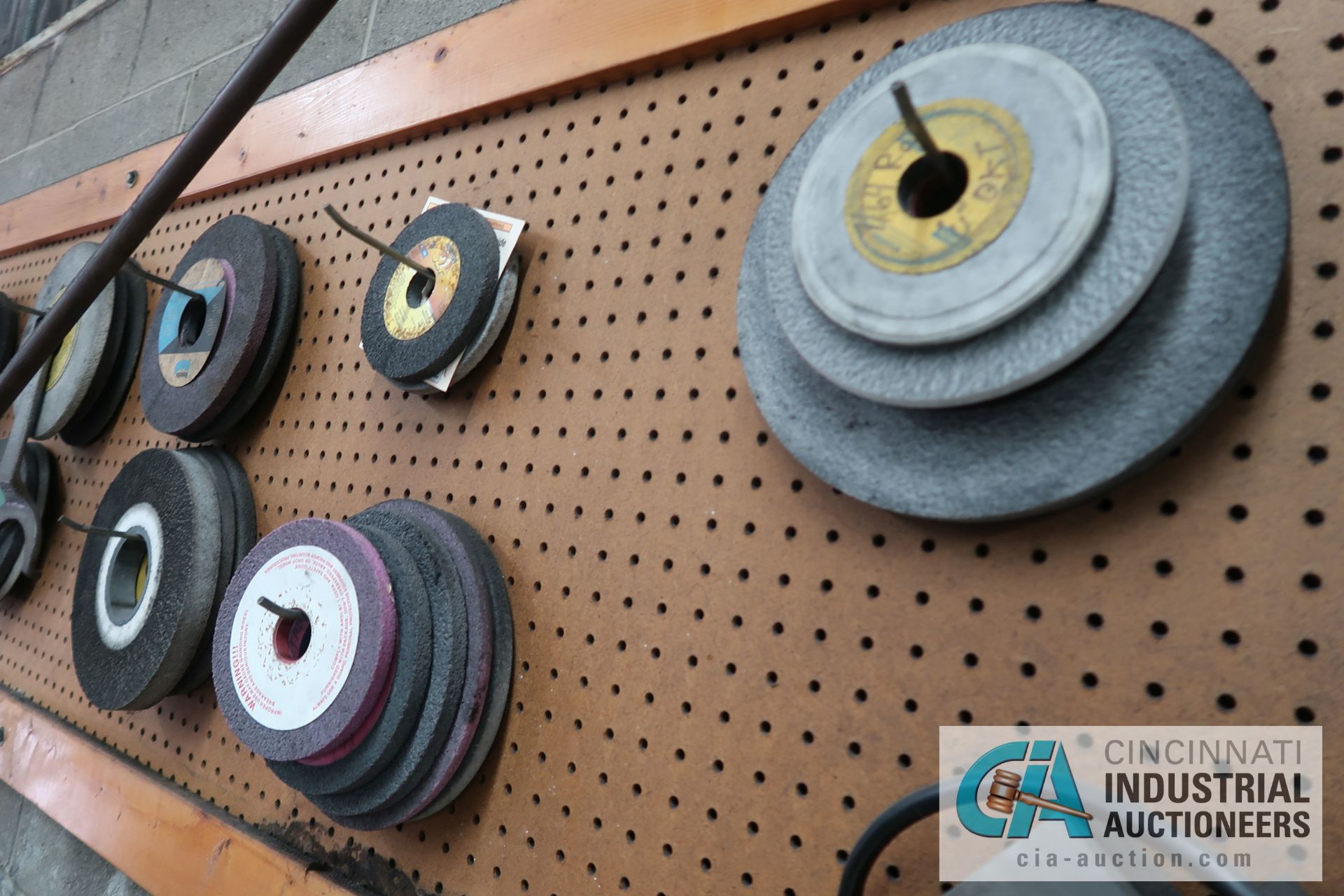 (LOT) MISCELLANEOUS GRINDING WHEELS ON WALL AND BENCH **PEGBOARD STAYS WITH BUILDING** - Image 6 of 7