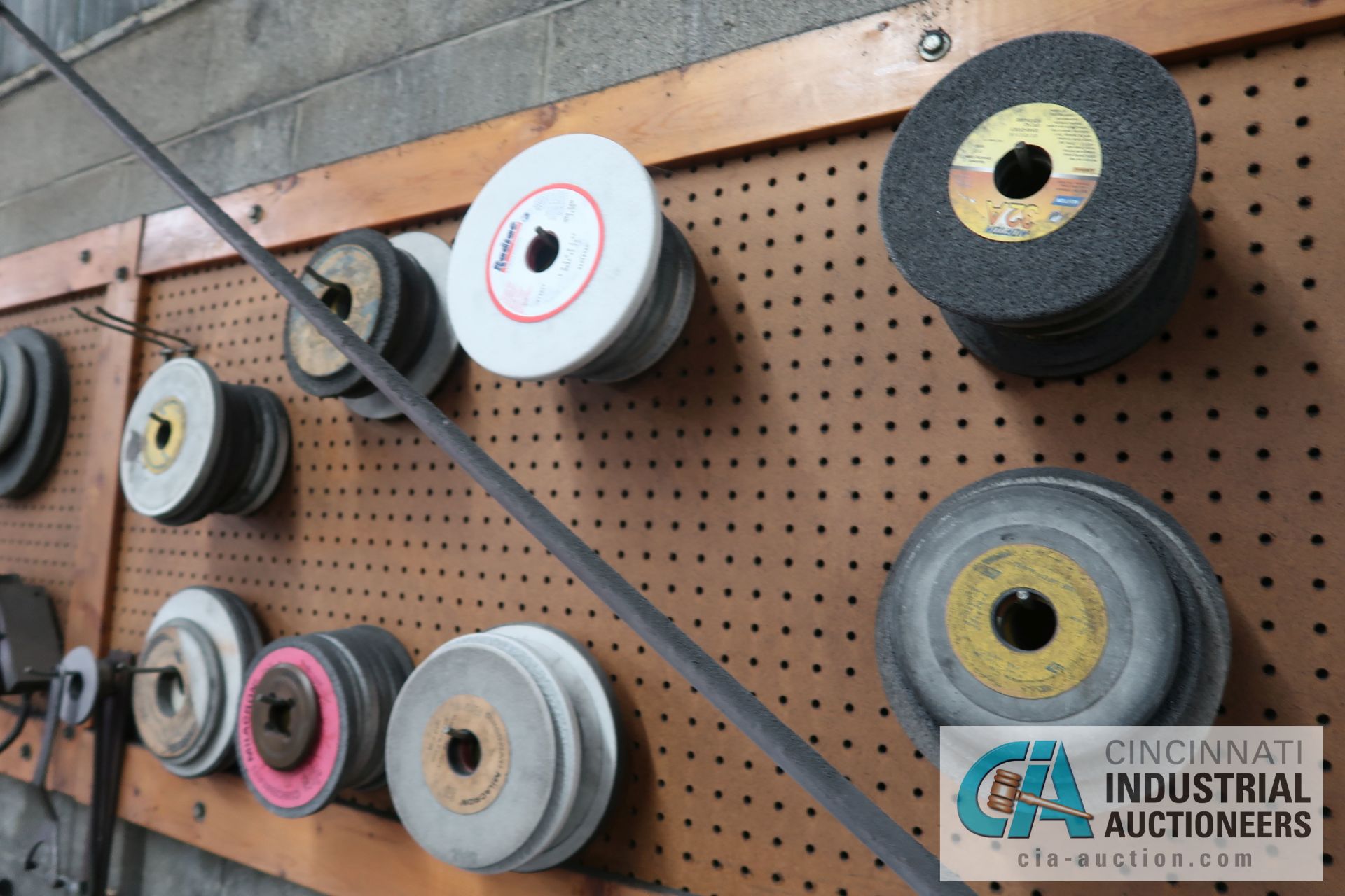 (LOT) MISCELLANEOUS GRINDING WHEELS ON WALL AND BENCH **PEGBOARD STAYS WITH BUILDING** - Image 5 of 7
