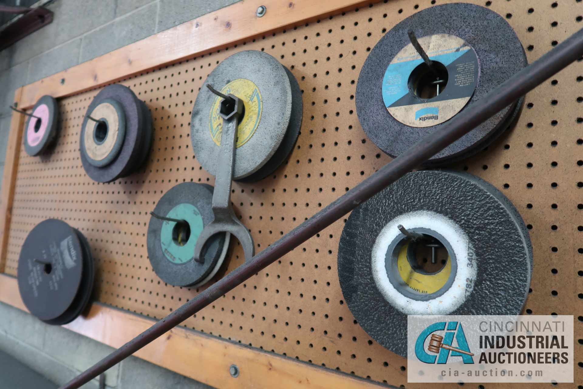 (LOT) MISCELLANEOUS GRINDING WHEELS ON WALL AND BENCH **PEGBOARD STAYS WITH BUILDING** - Image 7 of 7