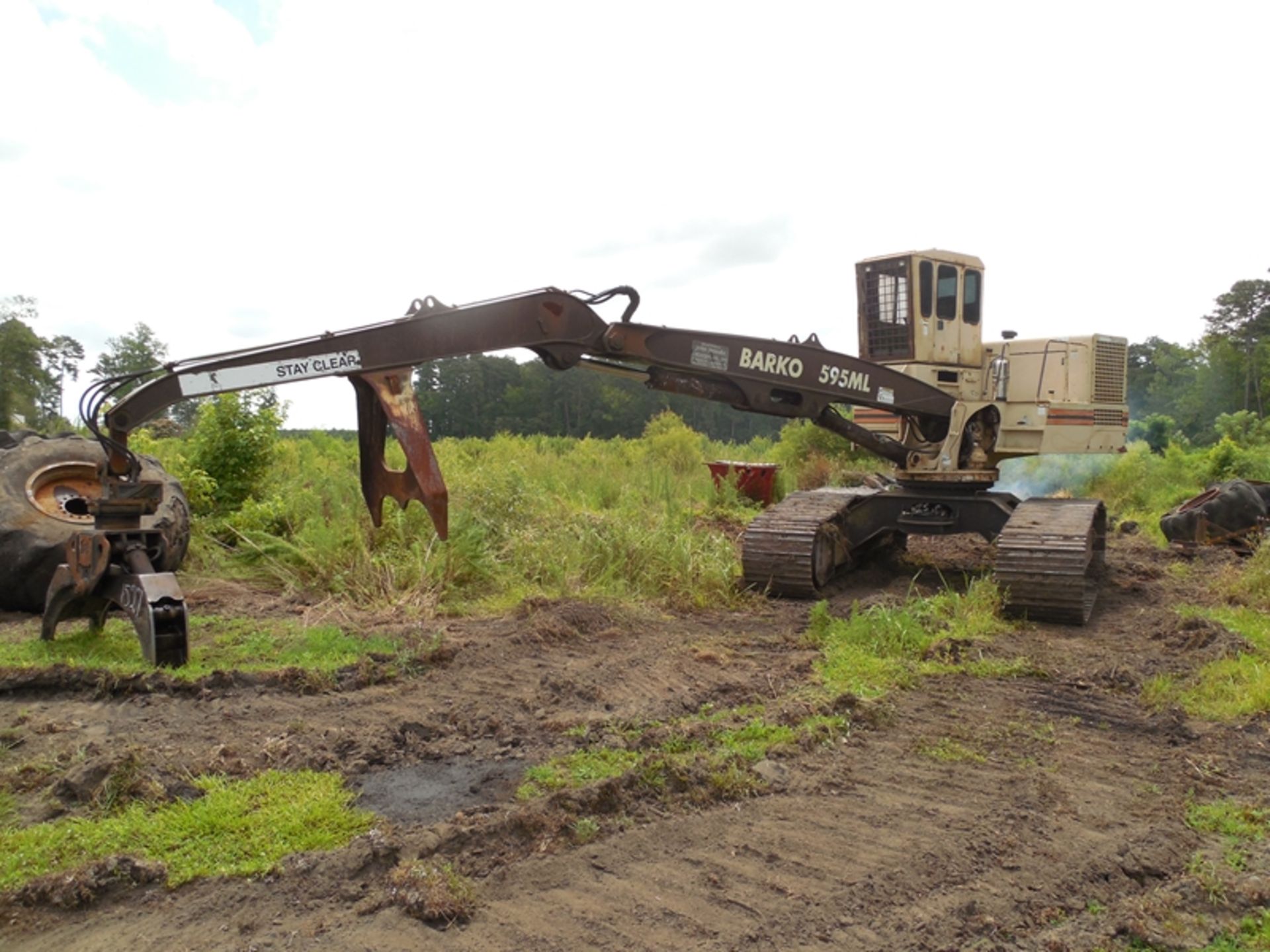 2004 Barco 595ML track log loader 5.9L cummins, 32' boom w/Robotec grapple, joy stick controls, saw