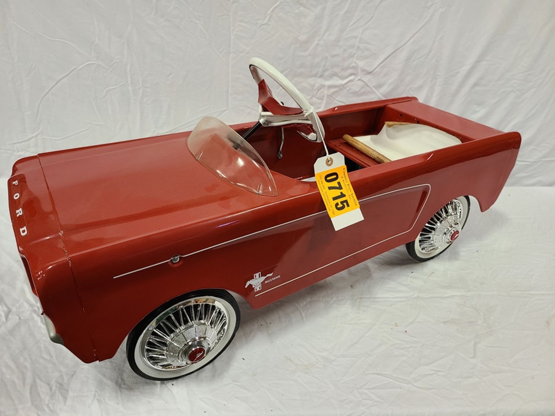 red "Ford Mustang" pedal car