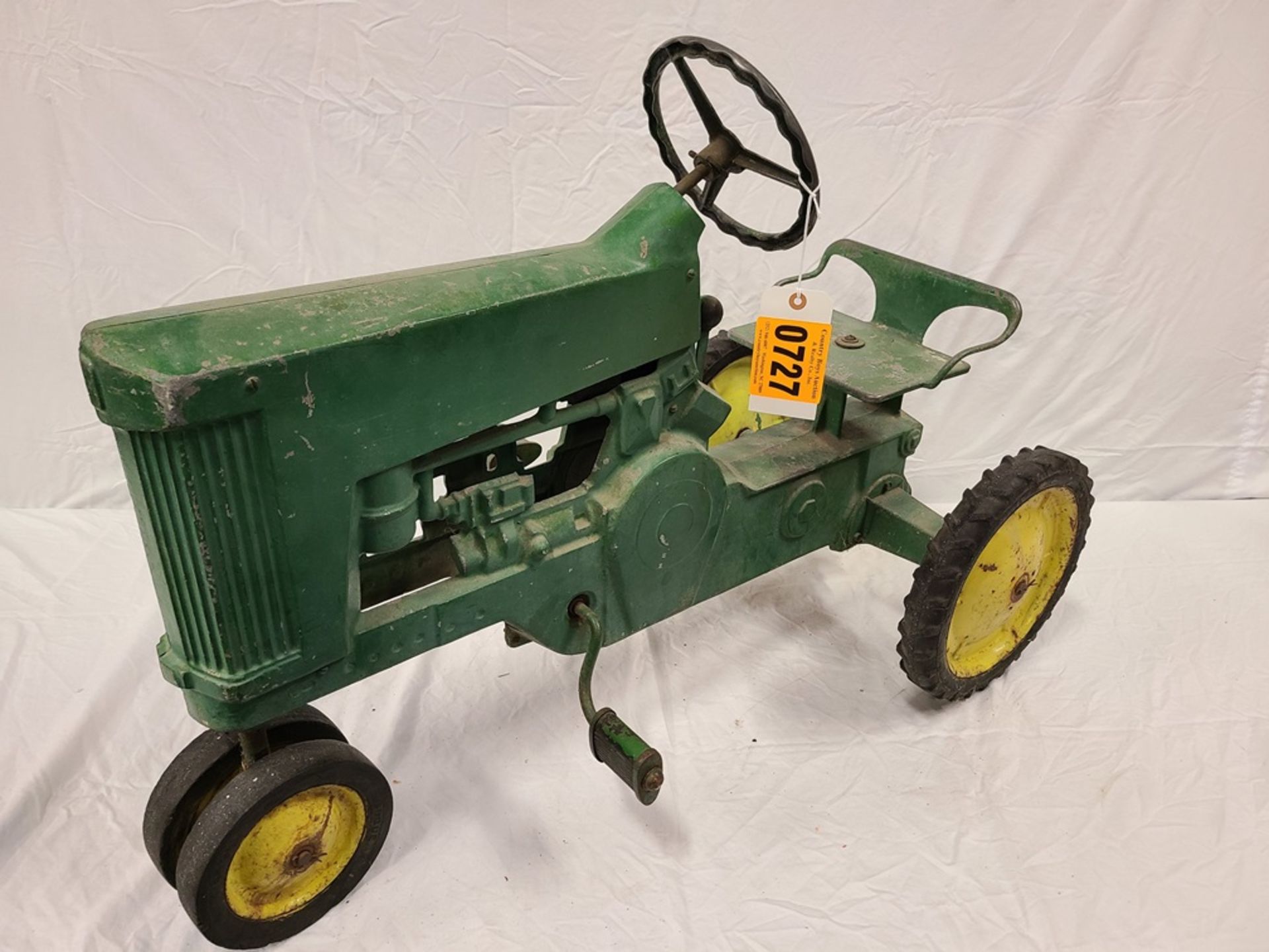 green and yellow "Tractor" tricycle pedal tractor