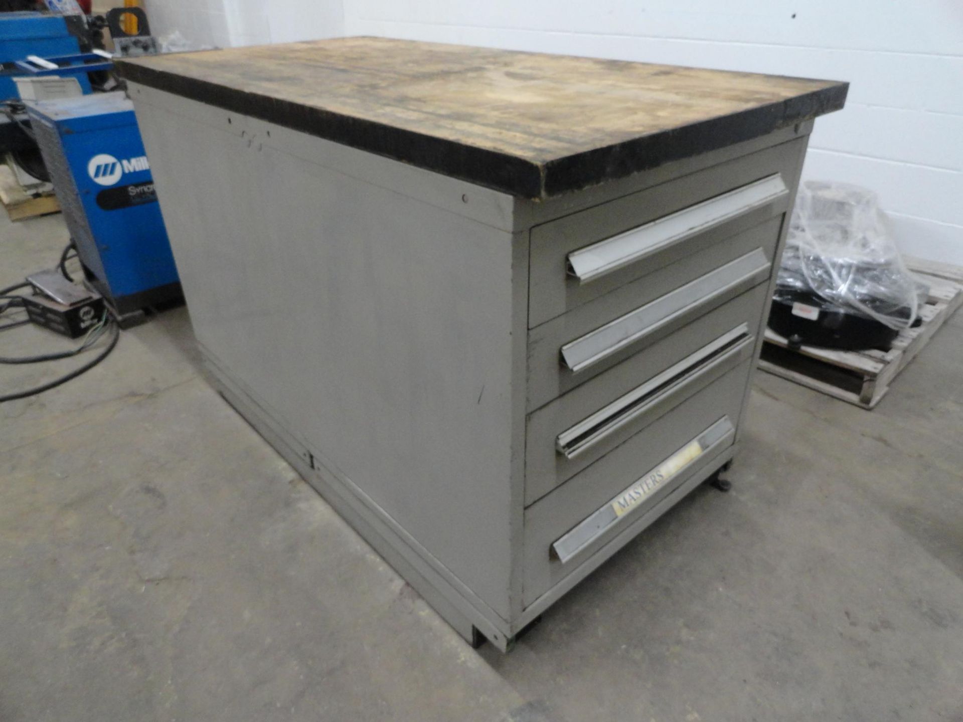 (2) 4-drawer heavy duty ball bearing drawer cabinets bolted together with butcher block top approxim