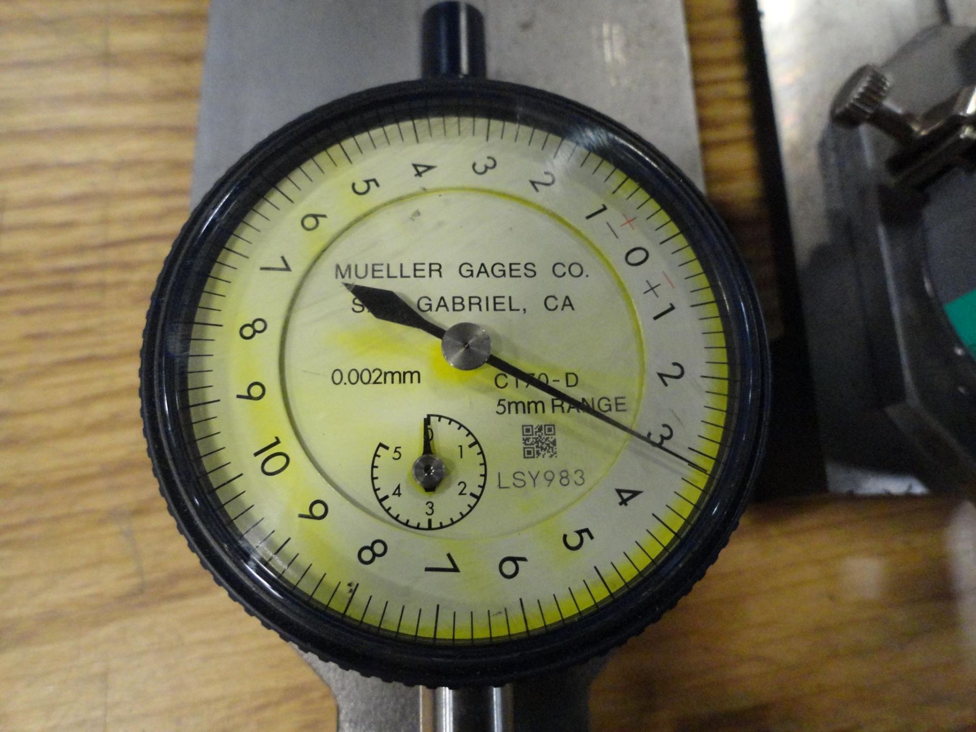 (3) Mueller Gages Indicators no. C170-D, 5mm range, .002mm increments, on metal table 3 x 6 inch