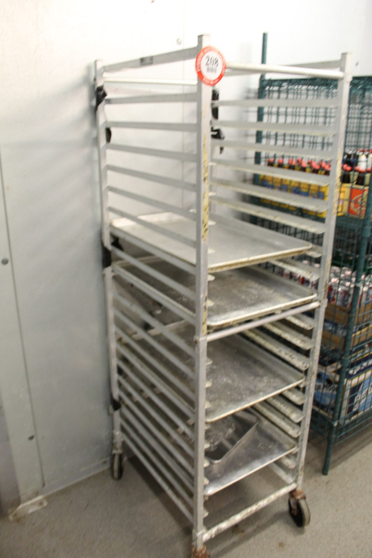 Contents of Walk-In Cooler: (7) Sections of Adjustable Metal Shelving (1) Aluminum Tray Cart