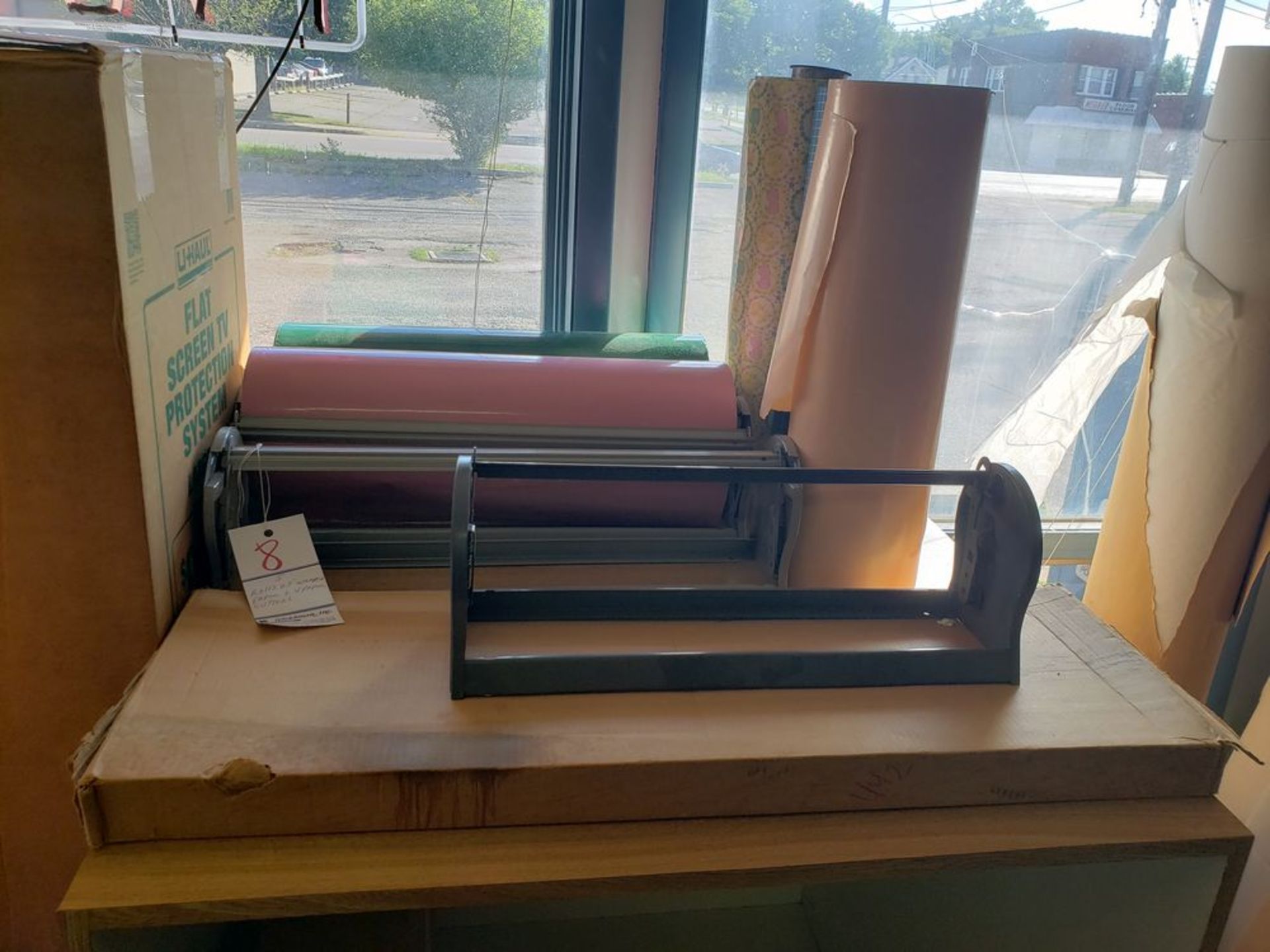 ROLLS OF WRAPPING PAPER WITH 4 PAPER CUTTERS (Note: Your bid is multiplied by the quantity)