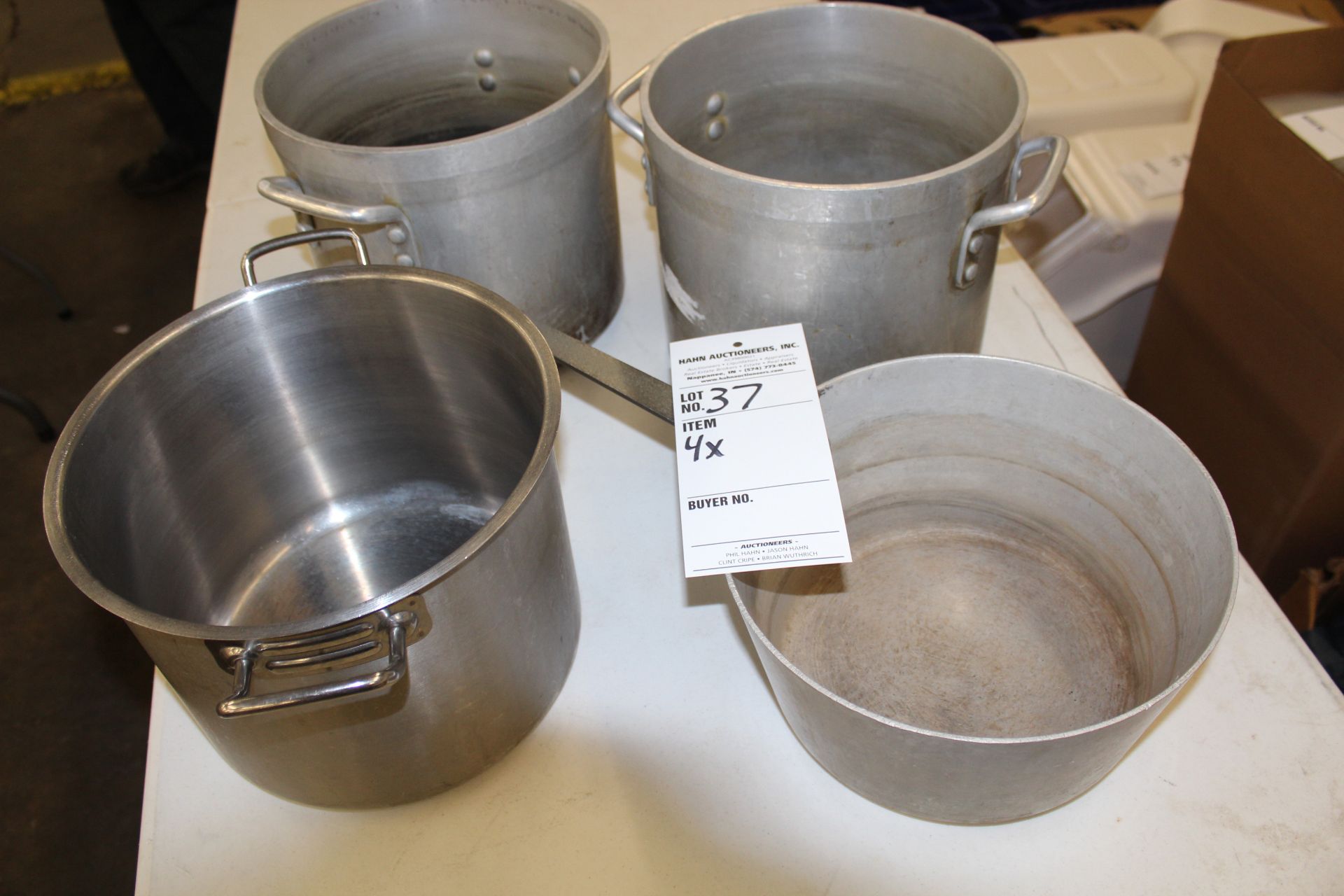 Four assorted stock pots