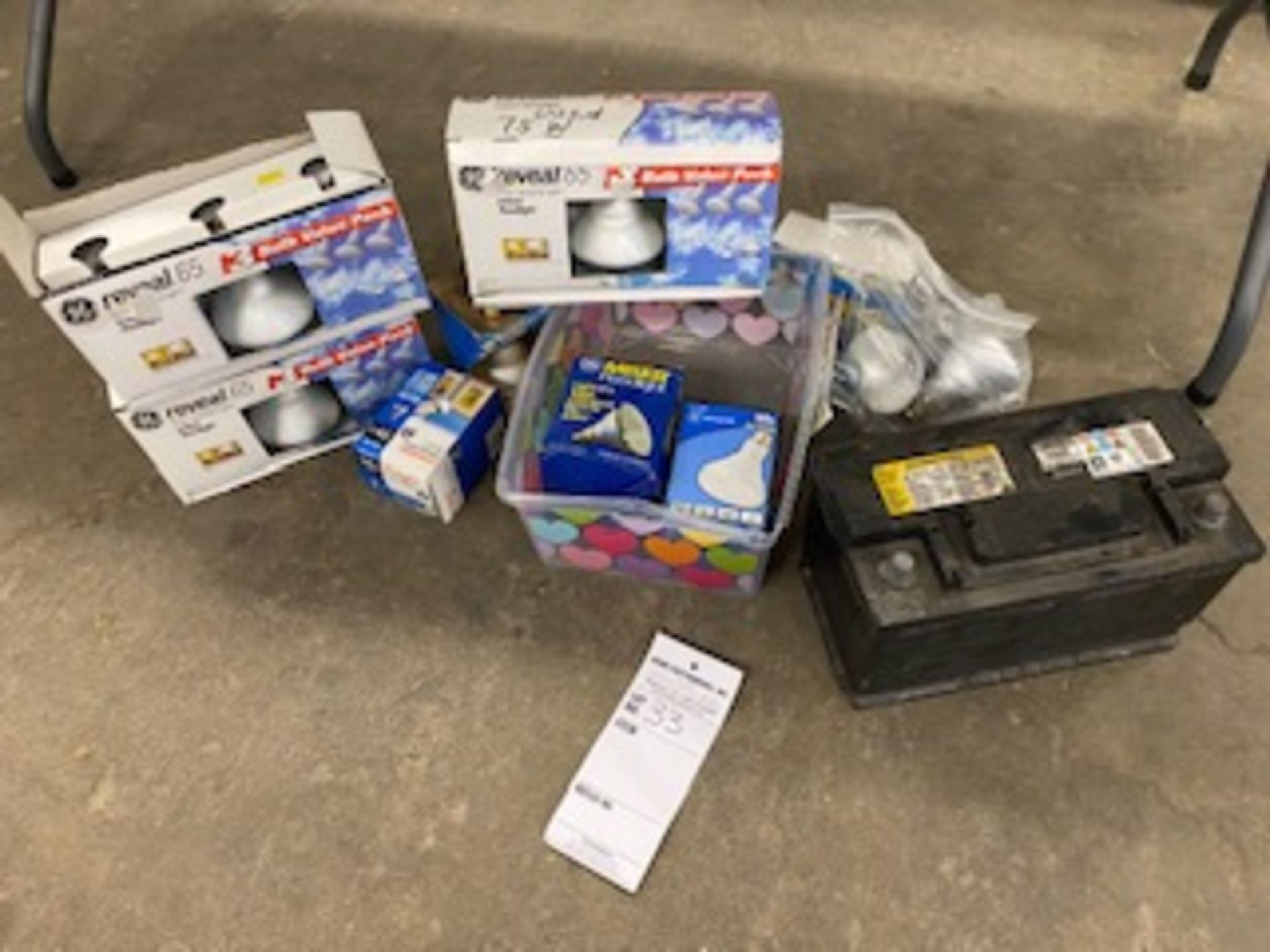 Assorted light bulbs and automotive battery