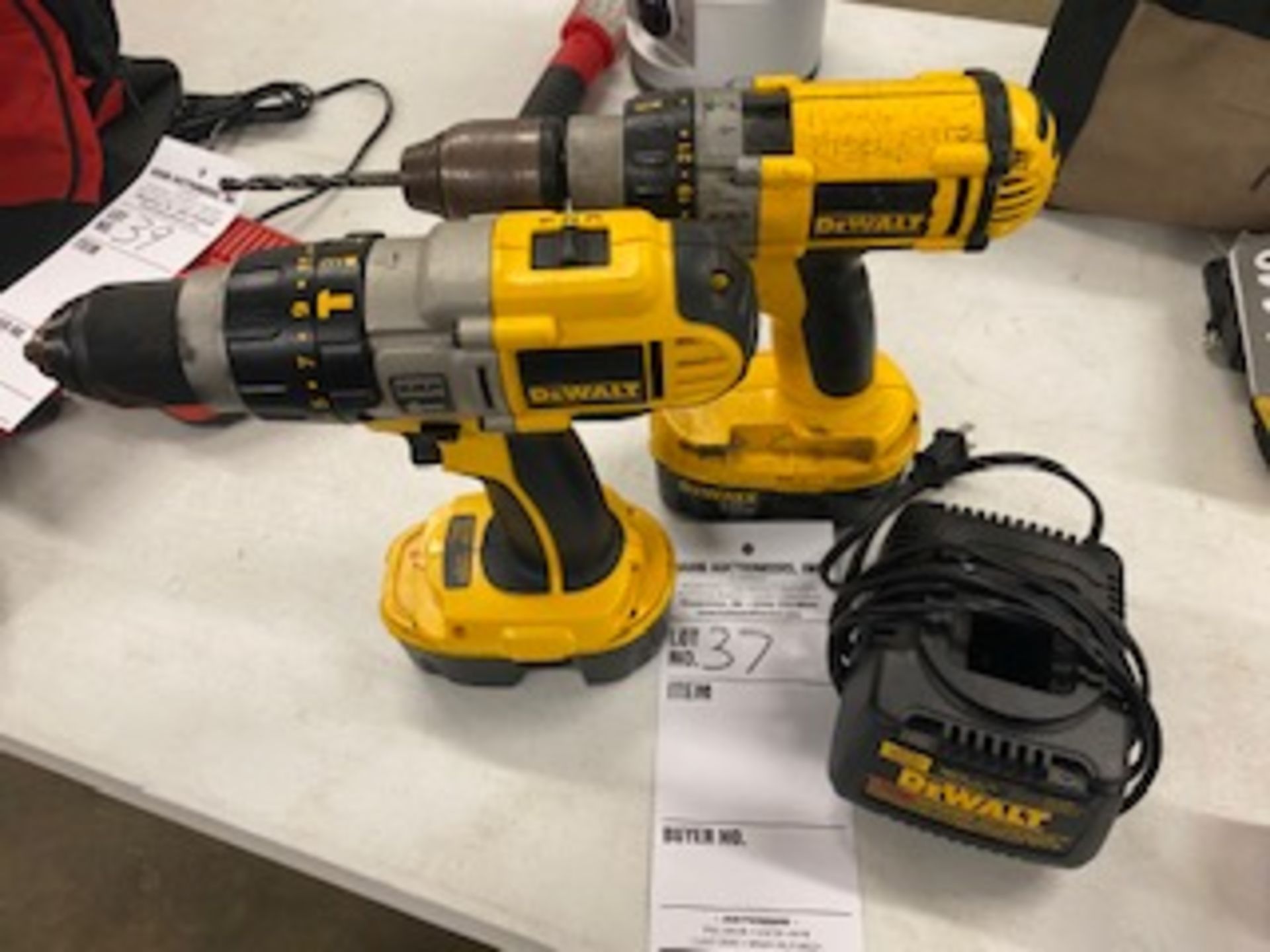 2 DeWalt 18v hammer drills, with 2 batteries and charger. 1 drill in like new condition