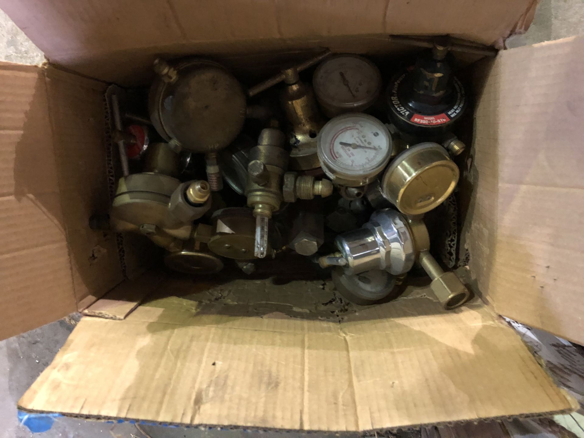 box of misc. used torch regulators