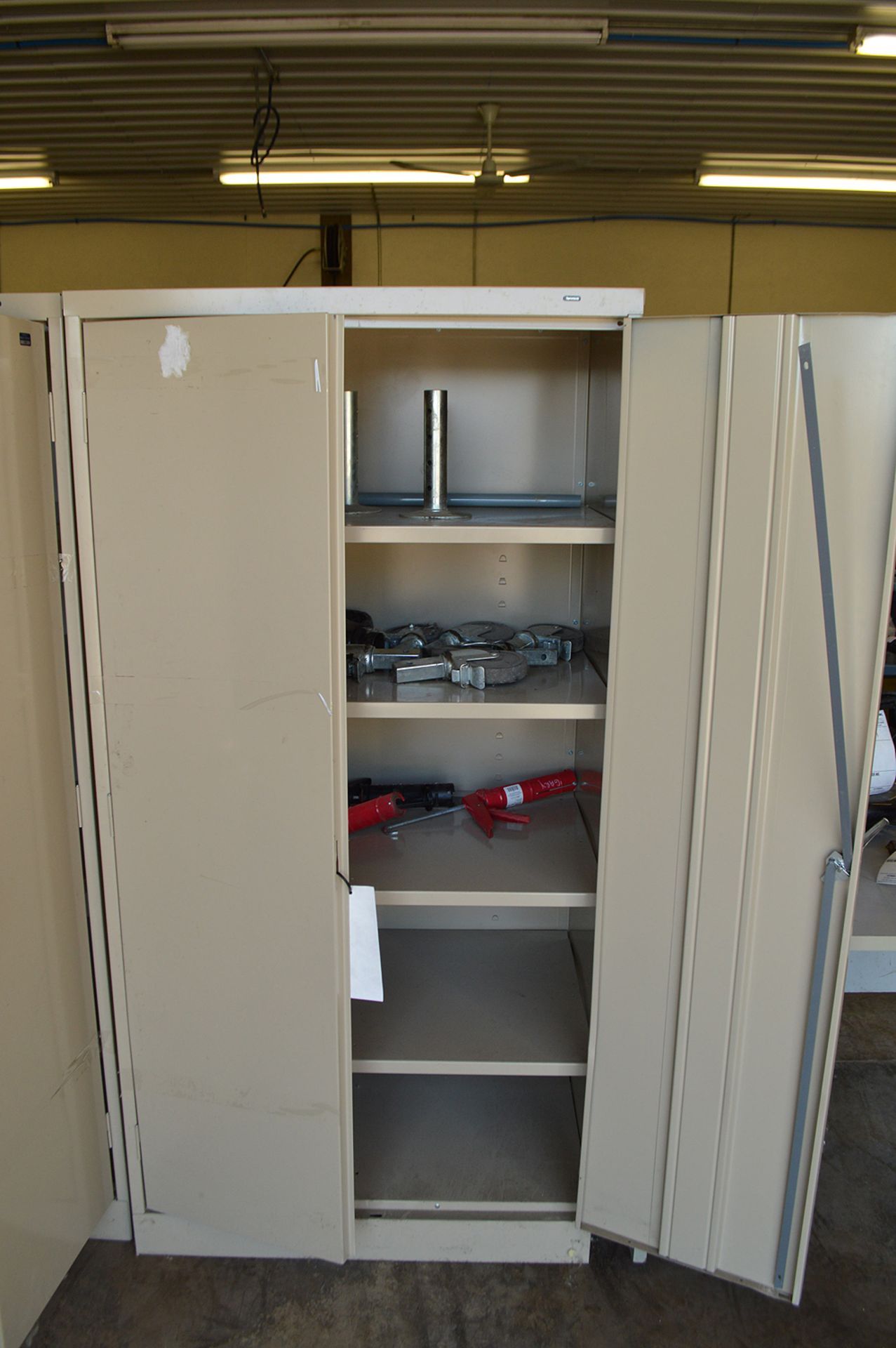 2 DOOR METAL CABINET 6' TALL W/ SOME CASTERS
