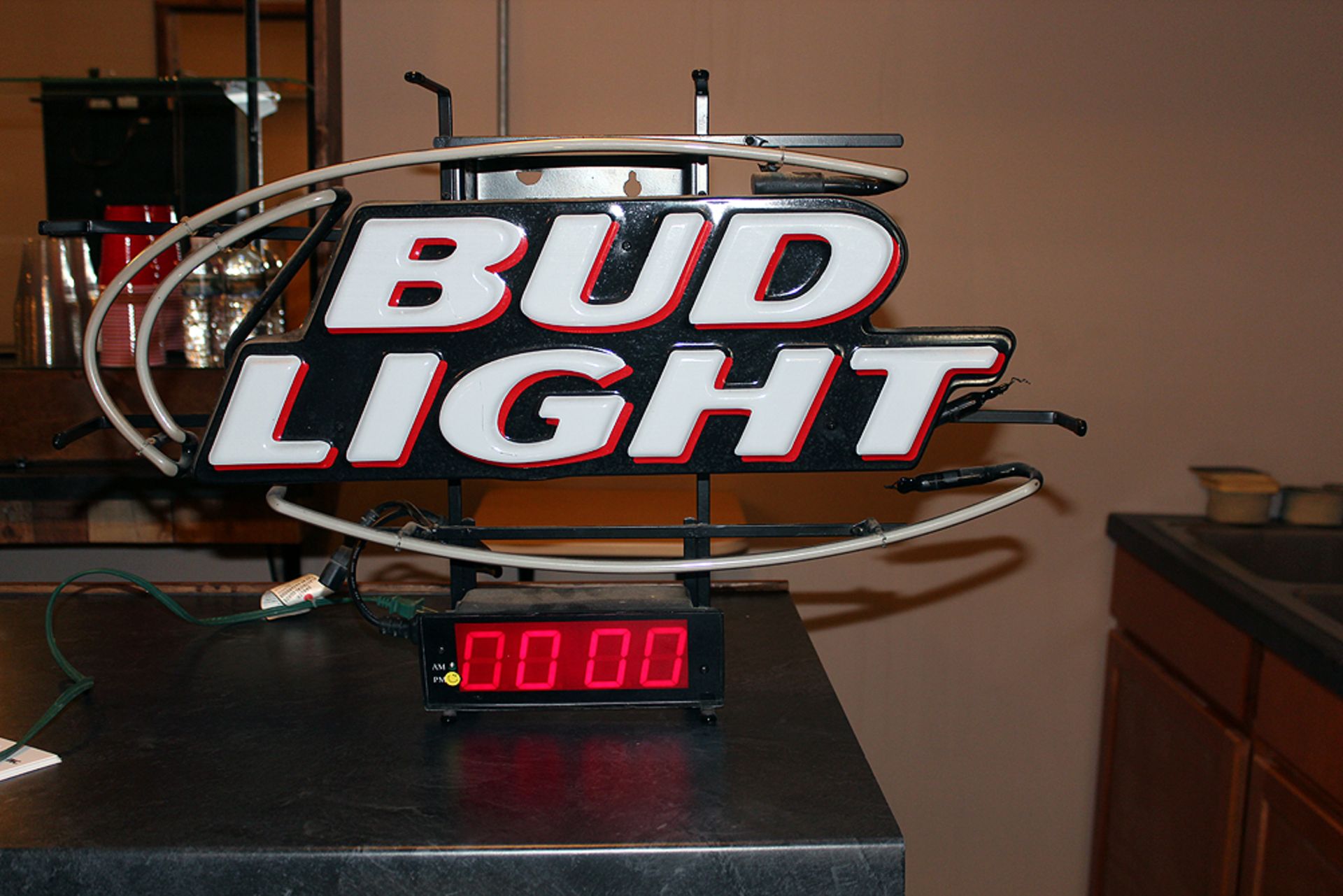 Bud Light lighted sign the top fluorescent does not work clock does