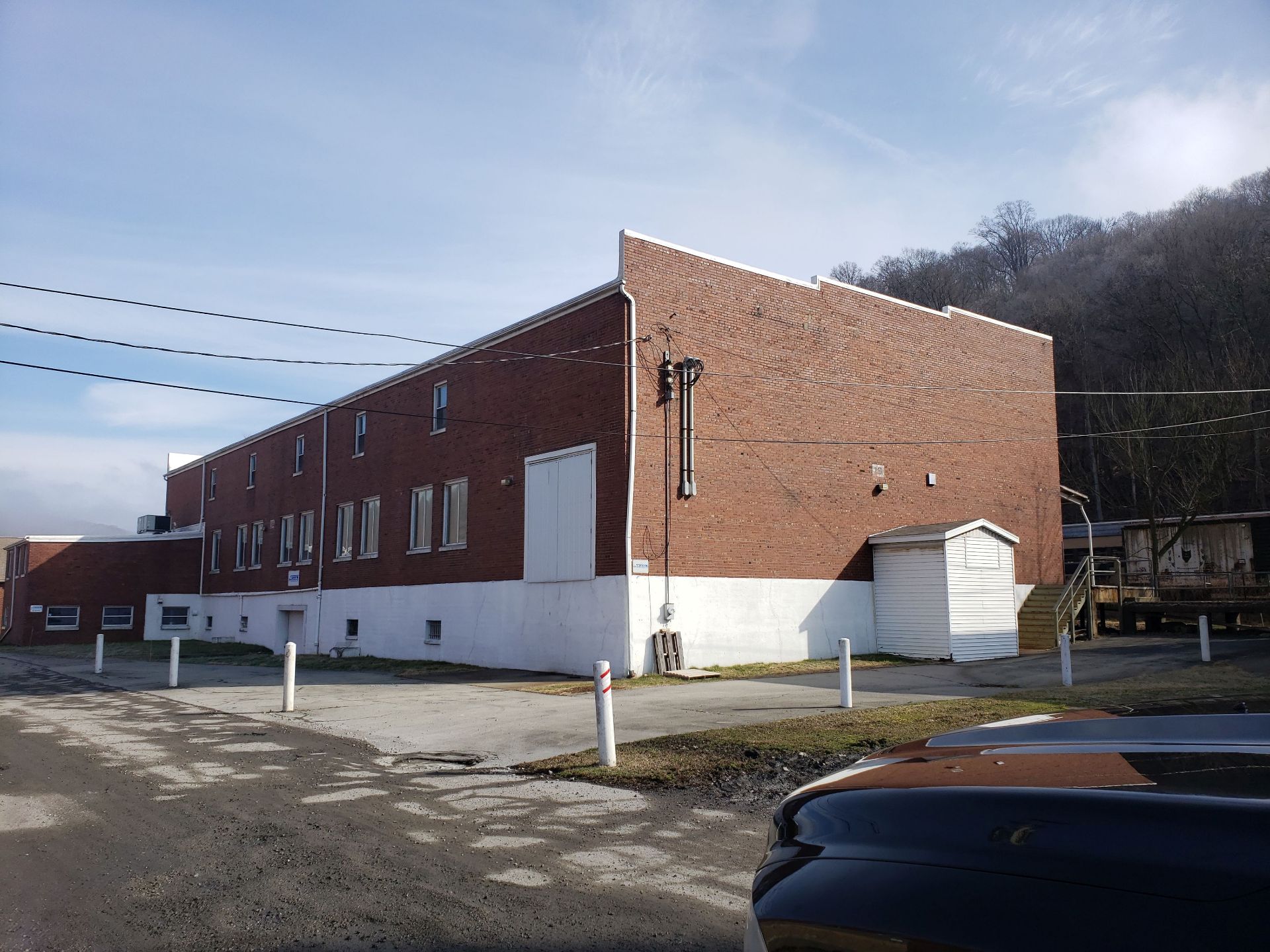 =/- 30,000 SF three story building with truck access, rail runs next to building