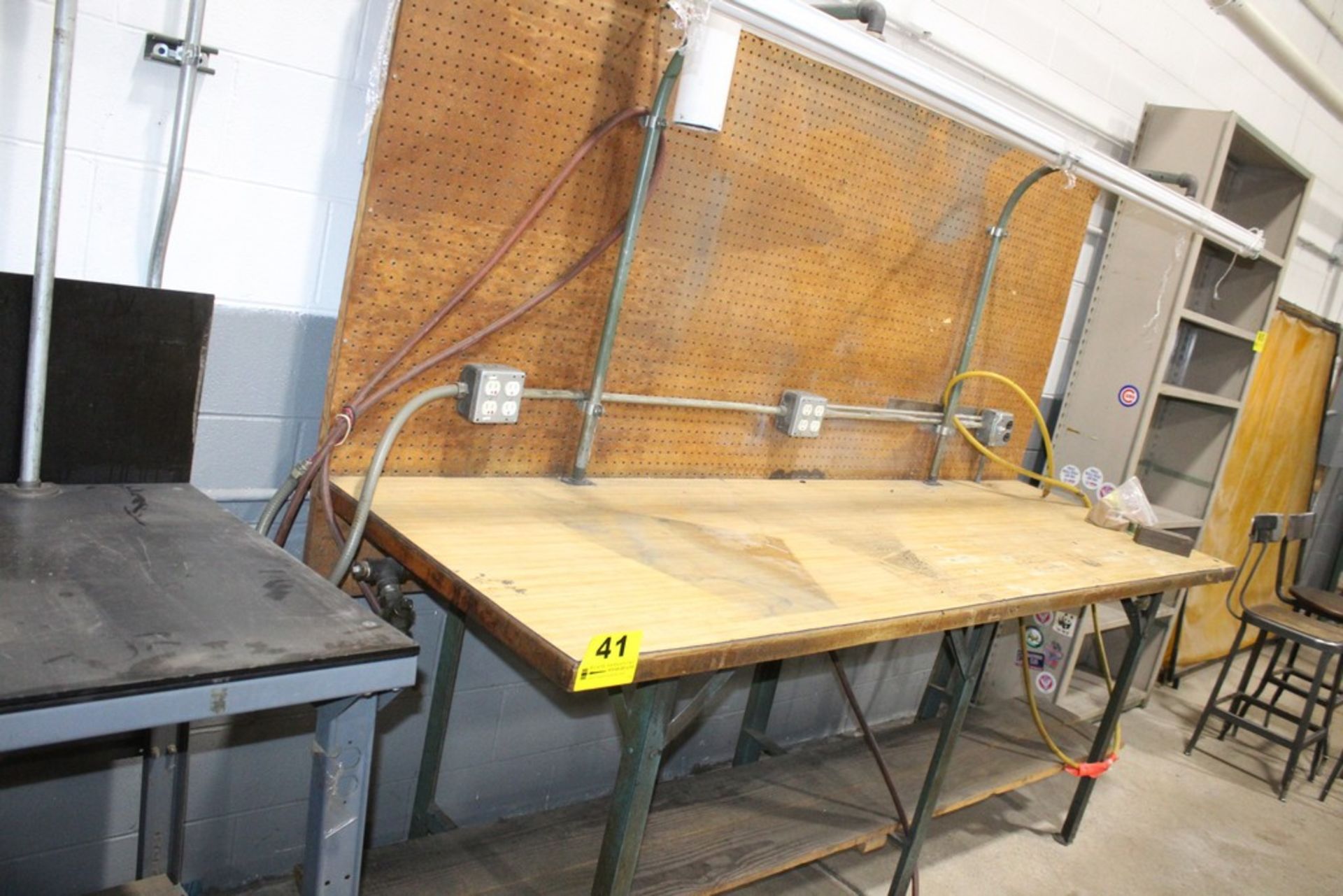 96" X 30" X 36" WOOD TOP, STEEL FRAME WORKBENCH WITH 110V OUTLETS AND OVERHEAD LIGHT LOADING FEE: $