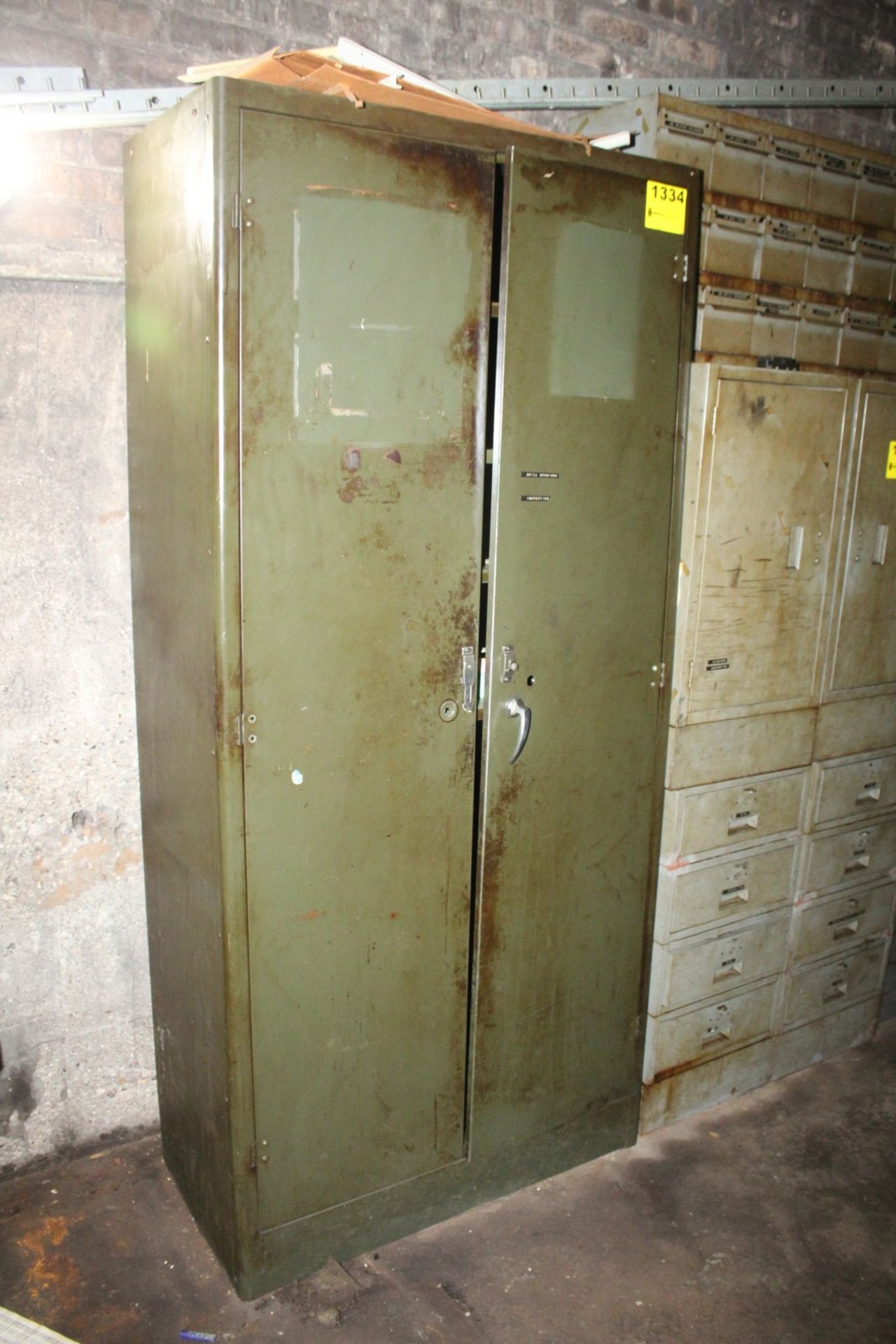 TWO DOOR STEEL CABINET WITH CONTENTS