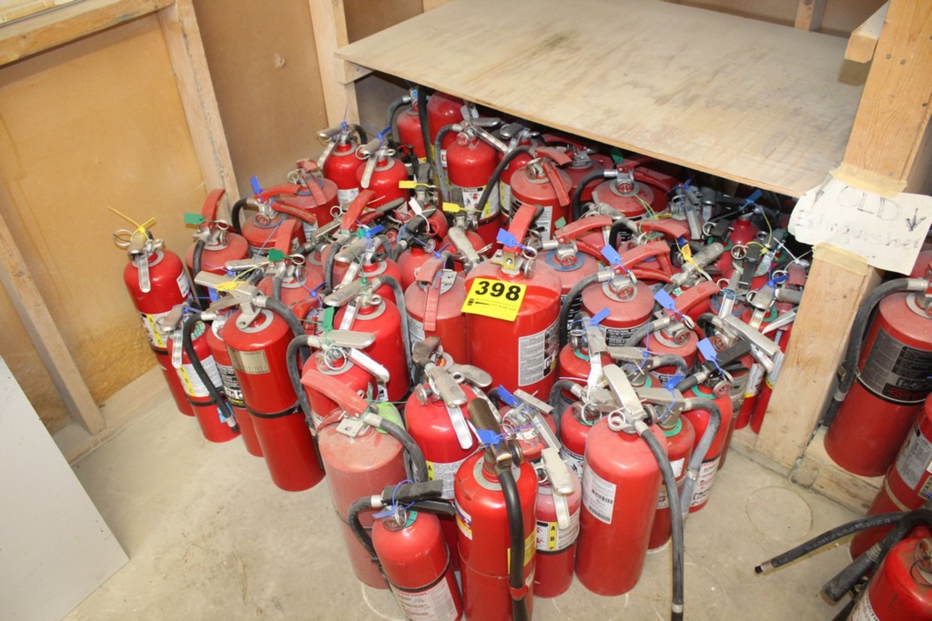 LARGE QTY OF FIRE EXTINGUISHERS ON FLOOR