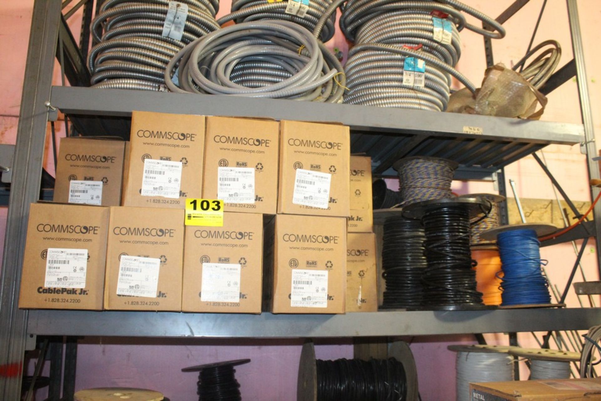 LARGE QTY OF COMMISCOPE COMMUNICATION WIRE ON SHELF