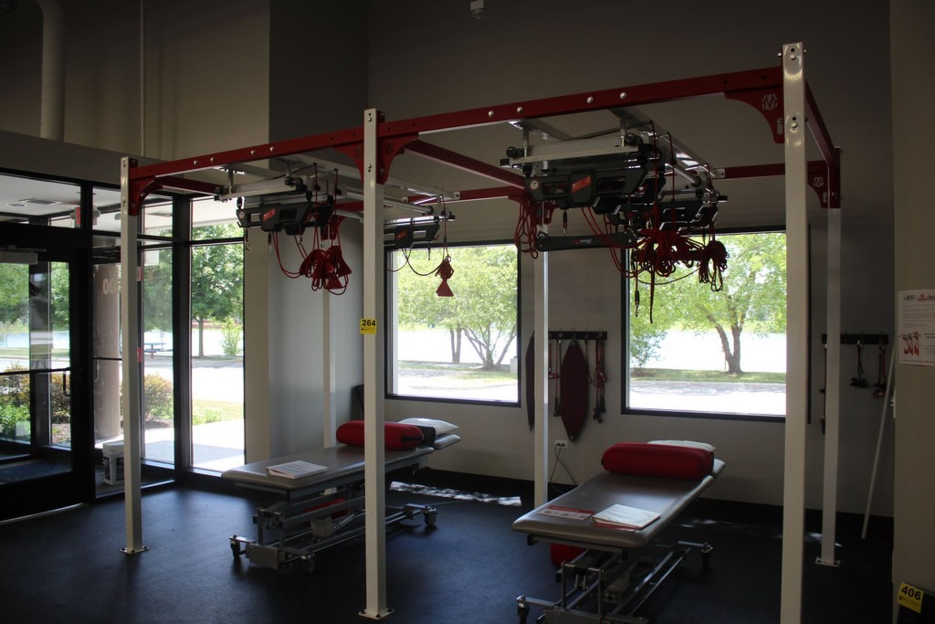NEURAC DUAL RED CORD WORK STATION, INCLUDING AXIS AND TRAINER MODULES, MOUNTED TO MOVESTRONG FRAME
