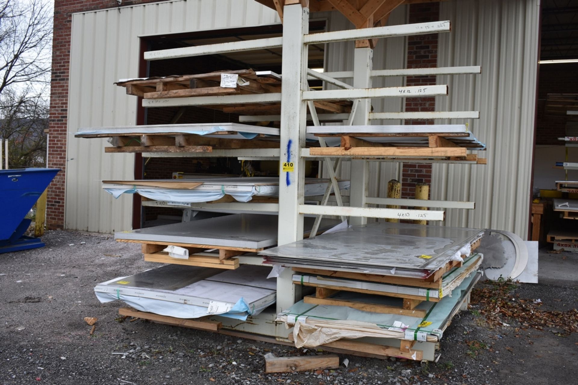 DOUBLE SIDED STEEL CANTILEVER RACK 74" X 9'6" H, (10) WELDED 48" ARMS EACH SIDE, WITH WOOD ROOF