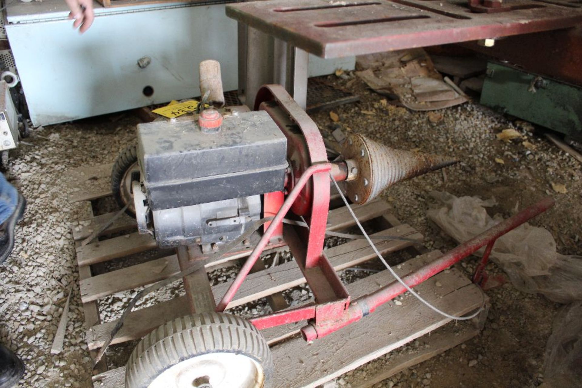 Gas power cork screw log splitter.