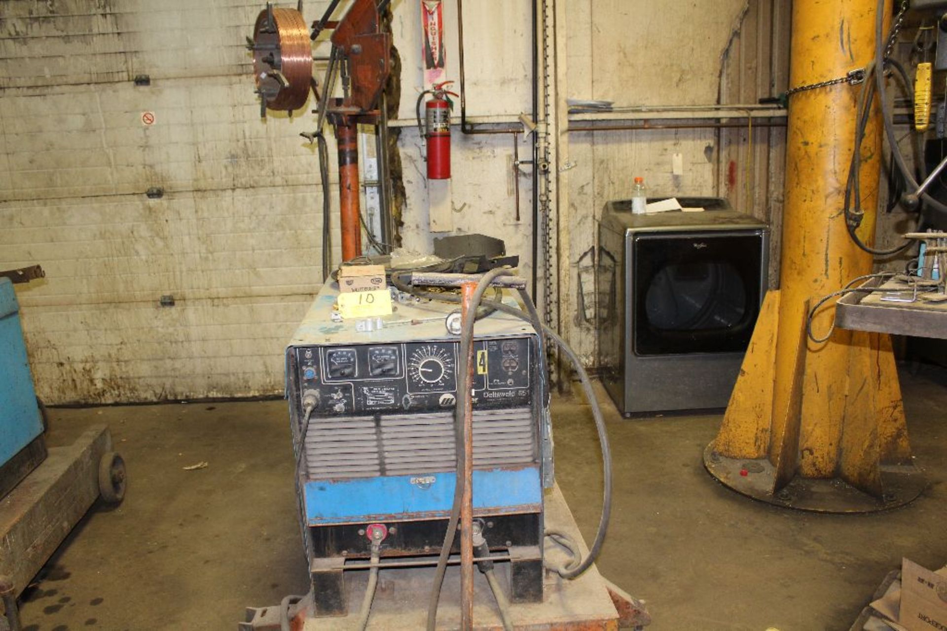 Miller welder Deltaweld, sn JJ464166, 651 wire feed boom, on cart.