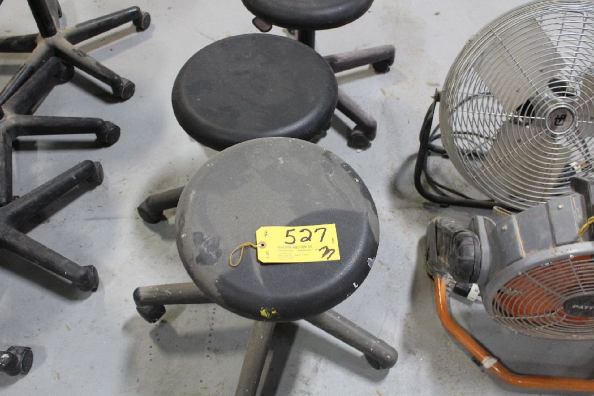 Adjustable rolling stools.