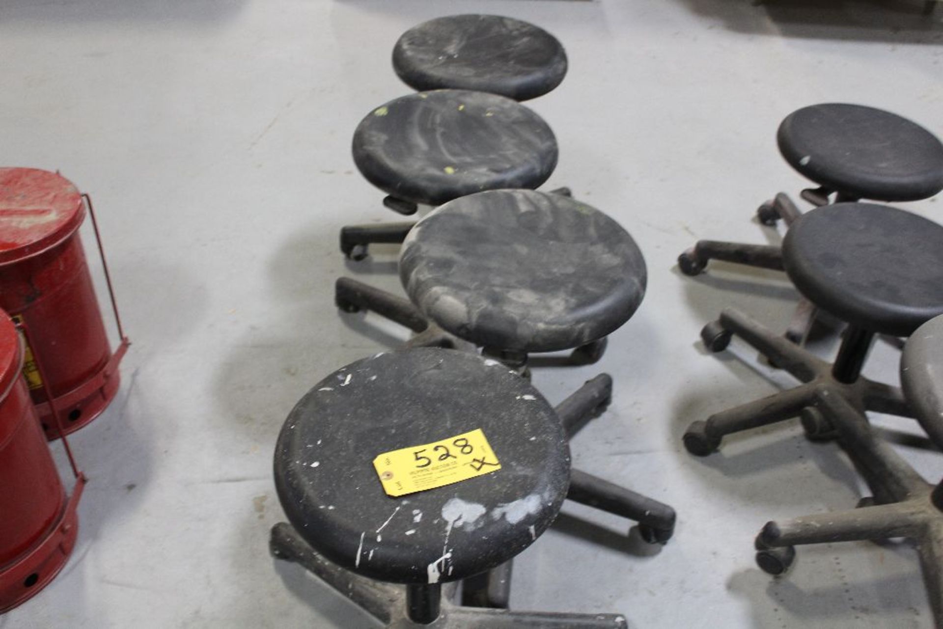 Adjustable rolling stools.