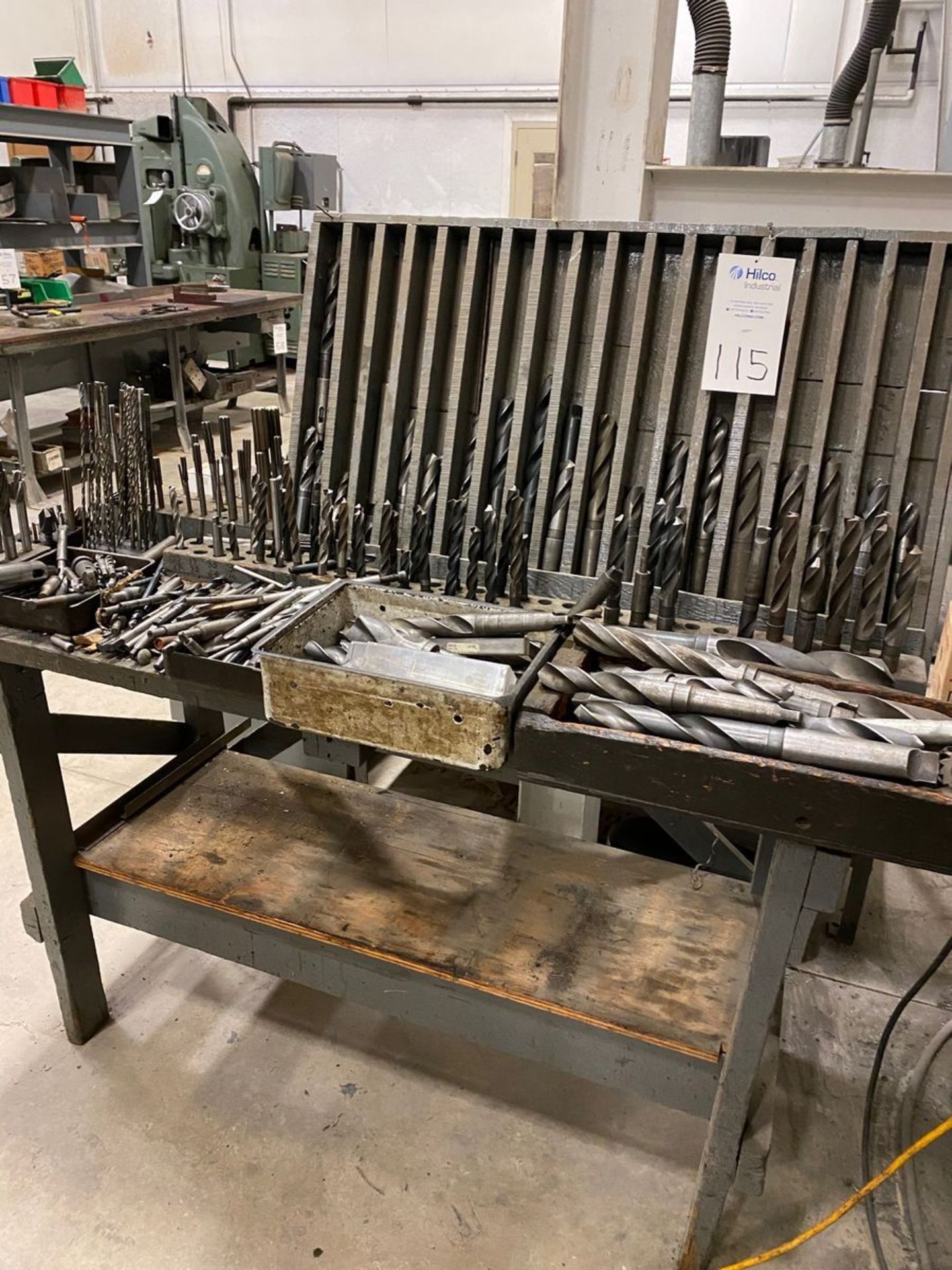 Lot of Various Size Drills With Wood Table