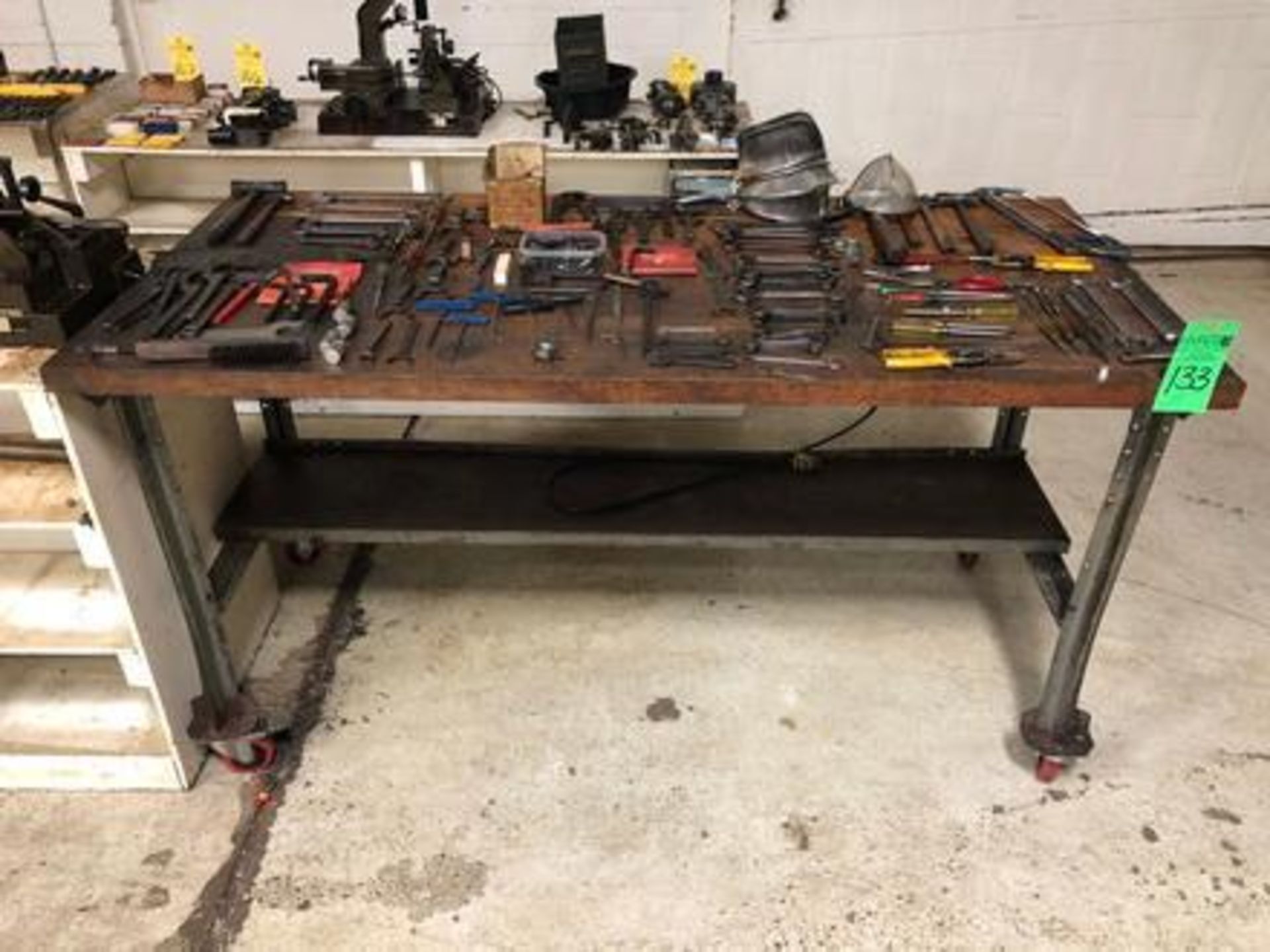 Assorted tools for Citizen Cincom CNC Screw Machines with wood top table and metal base