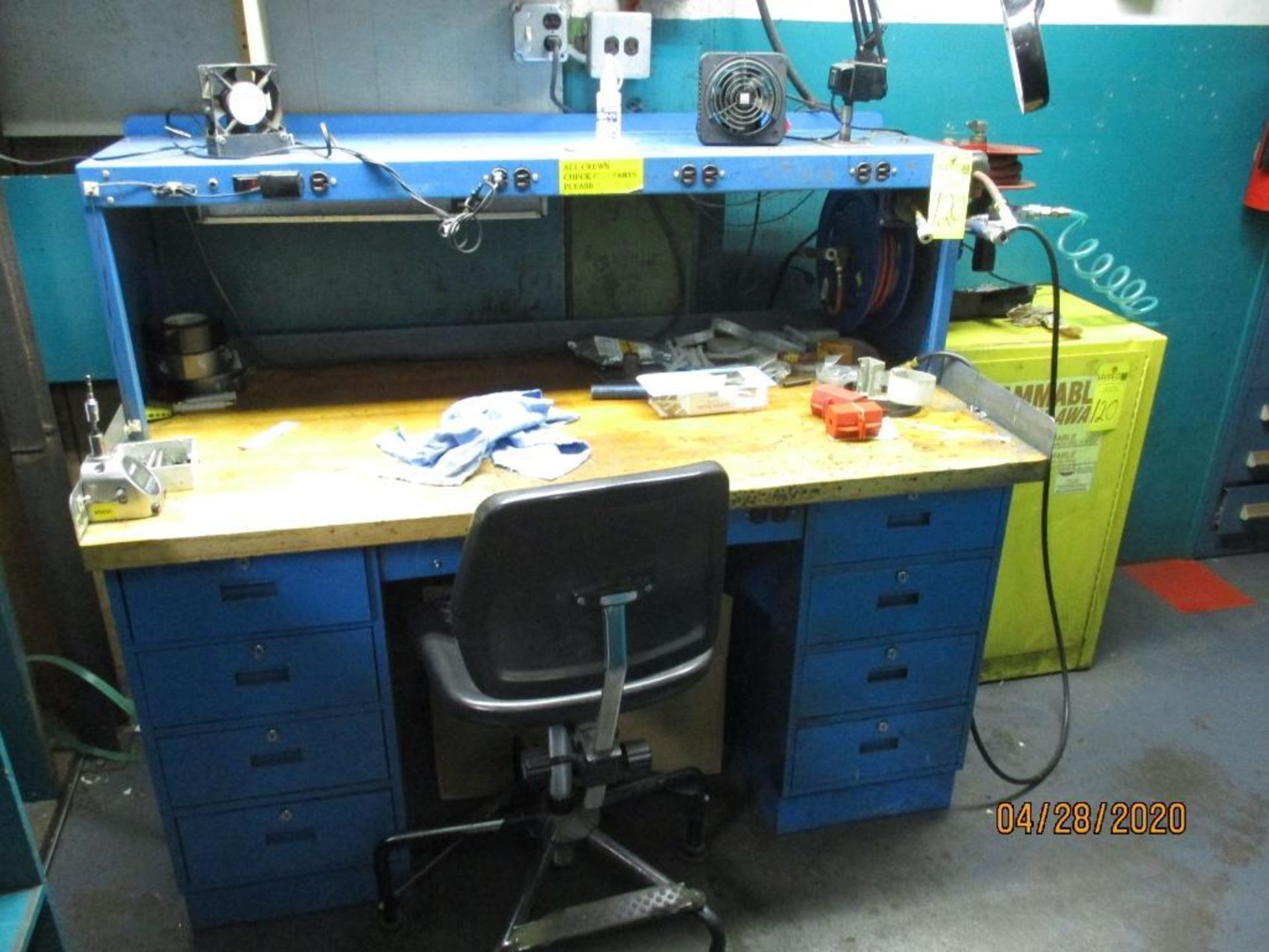 Work Bench With Electrical Outlets, Two Air Hose Reels, Magnifier Light, And Small Flammable Cabinet