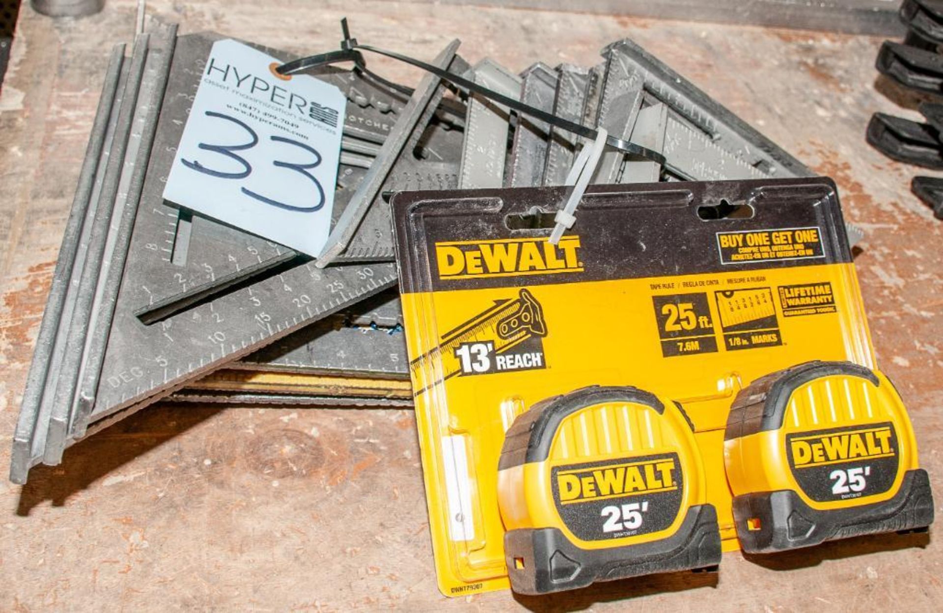 Lot c/o: (5) 12" Rafter Squares, (9) 7" Speed Squares & (2) New In Package Dewalt 25' Tape Measures