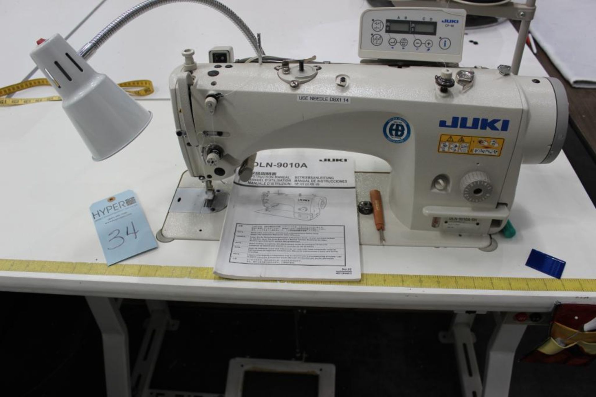 Juki model DLN-9010A-SH sewing machine s/n 2D31000018 w/Sewing Table