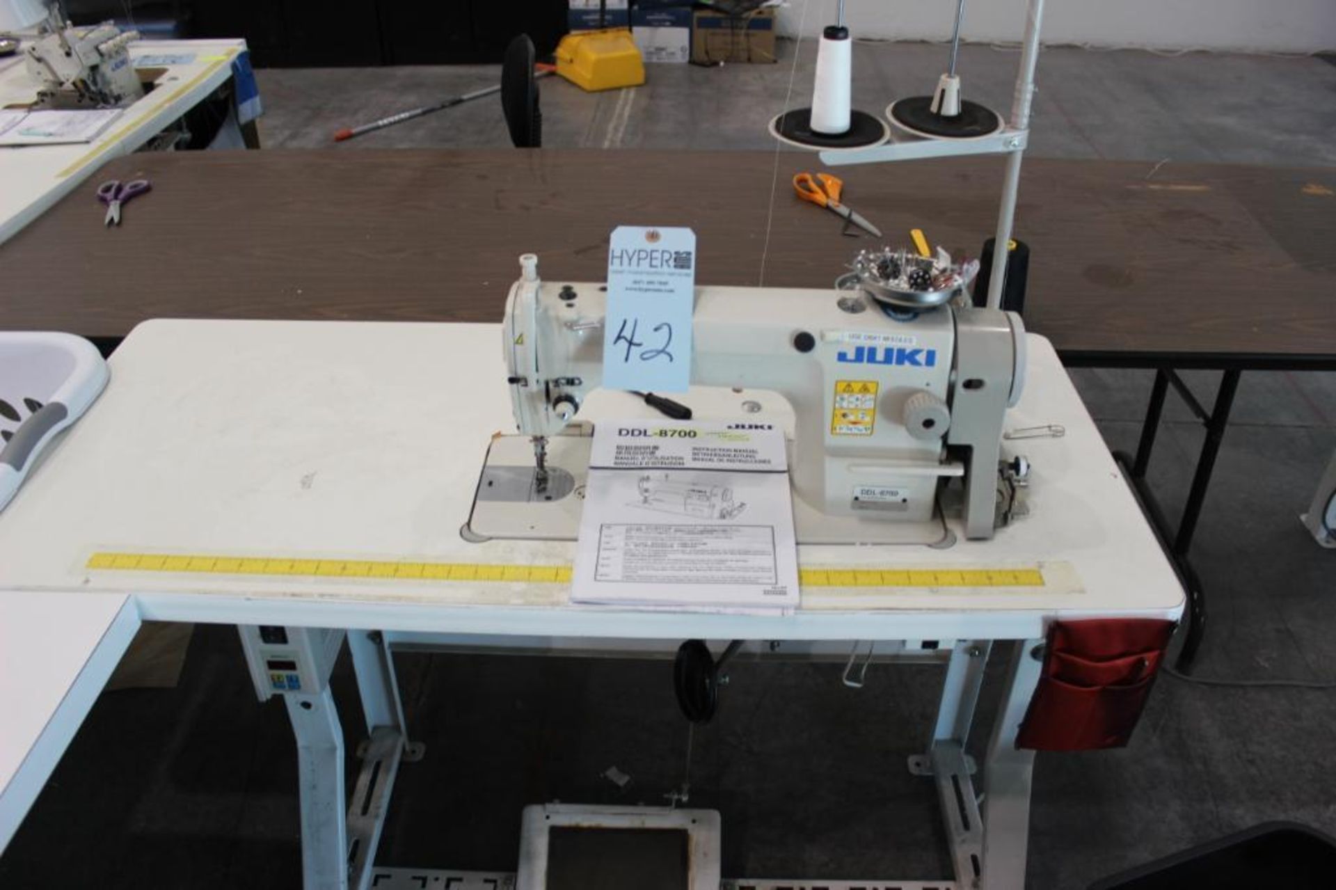 Juki model DDL-8700 sewing machine s/n 400HF12333 w/Sewing Table