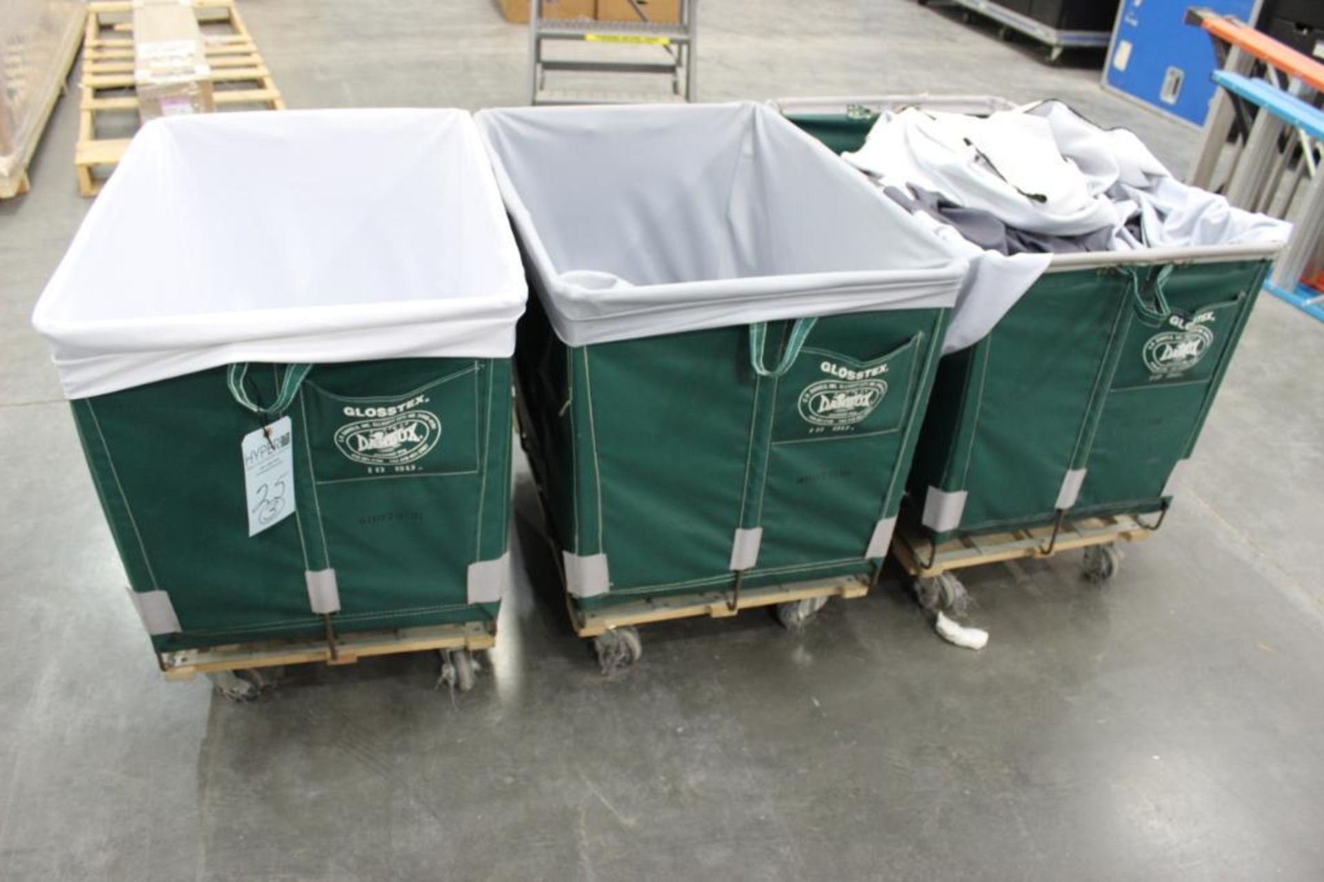 (3) 10-bushel Dandux laundry carts