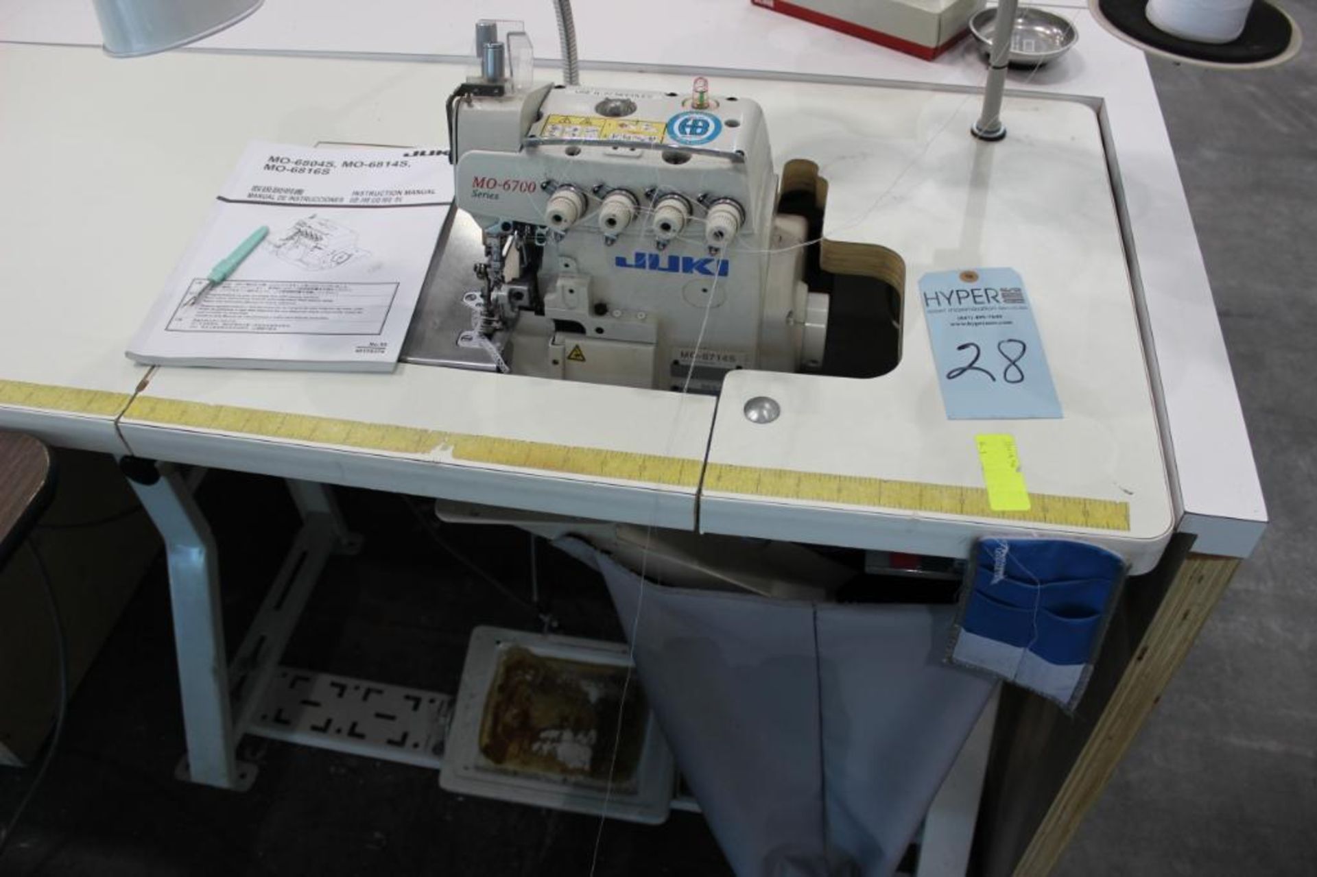 Juki model MO-6714S serging machine class BE6-40H s/n 8MOGM11231 w/Sewing Table