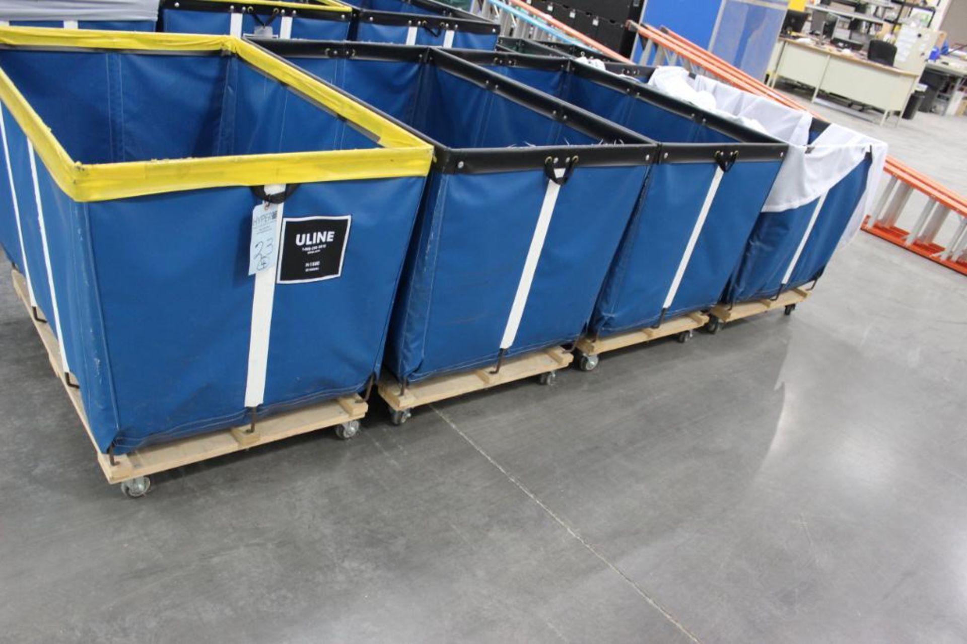 (4) Uline 20 bushel Model H-1580 laundry carts