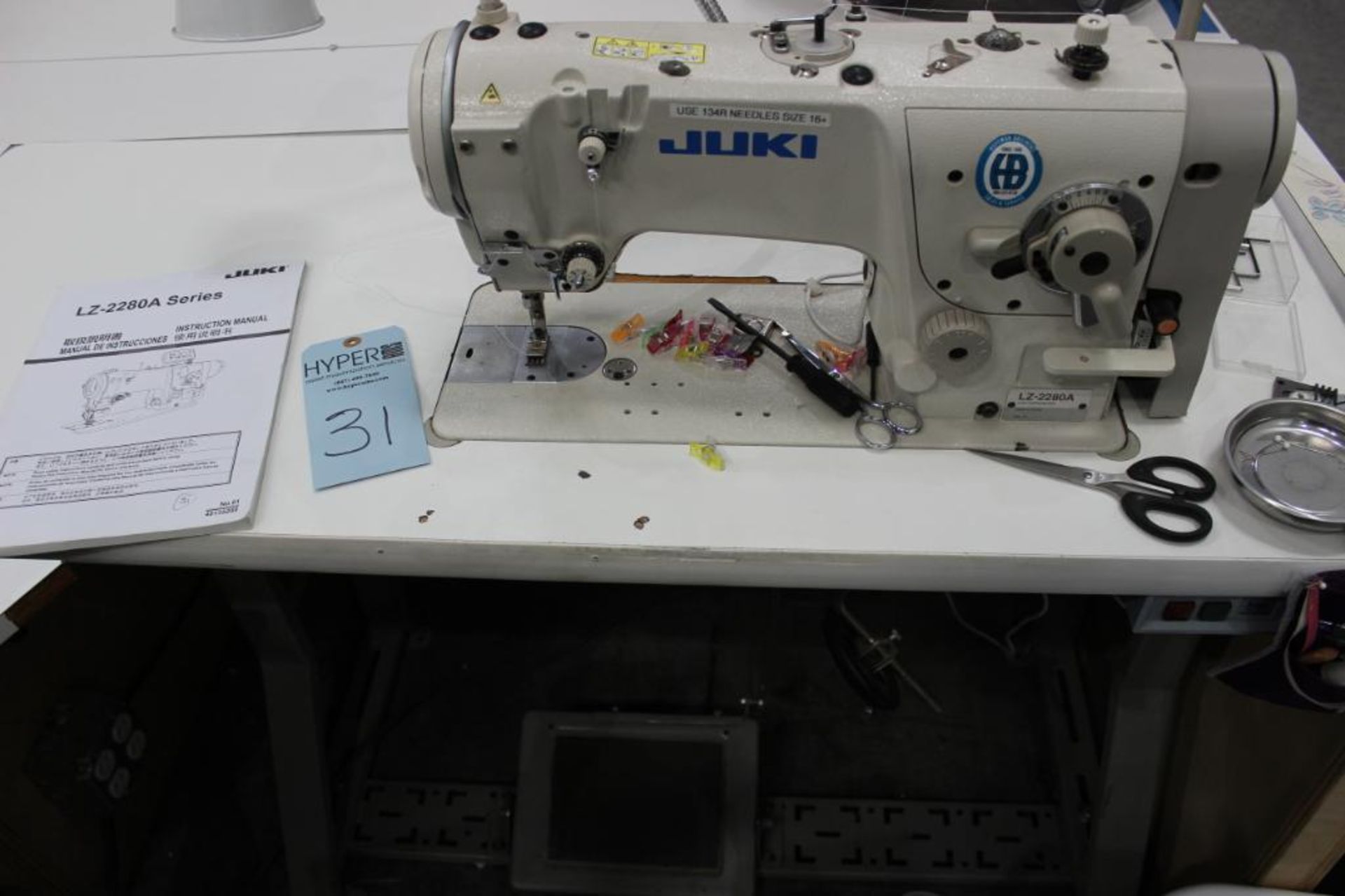 Juki model LZ-2280A sewing machine s/n 8L2GH11259 (est.) w/Sewing Table