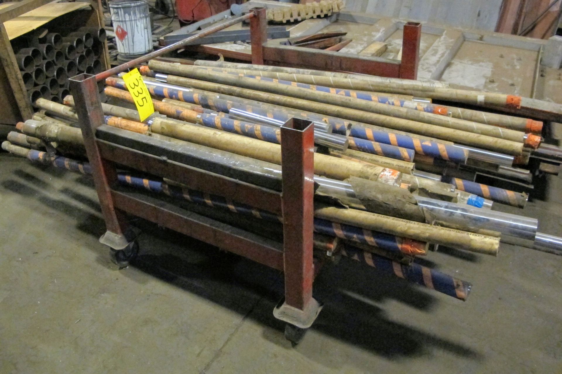 LOT OF STEEL CYLINDER STOCK ON ROLLING CART