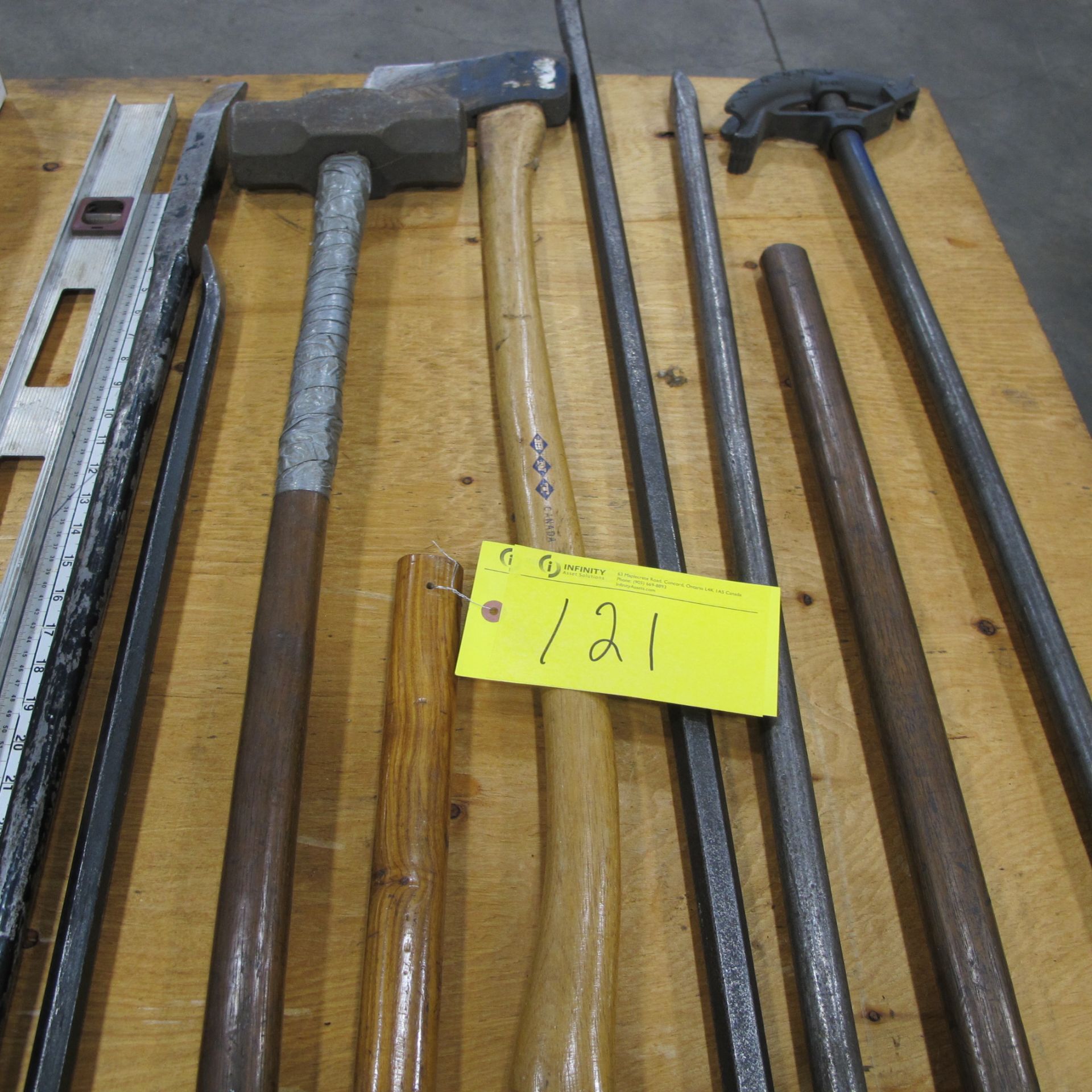 LOT OF LARGE HAND TOOLS (SLEDGE HAMMERS, CONDUIT BENDER, PRY BARS, AXES, LEVEL)