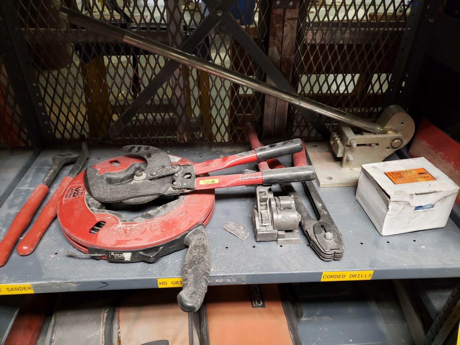 CONTENTS OF SHELVES RACK 2, SHELF 3, WRENCHES, FISH TAPE, LARGE CUTTER, METAL BANDING AND CRIMPING